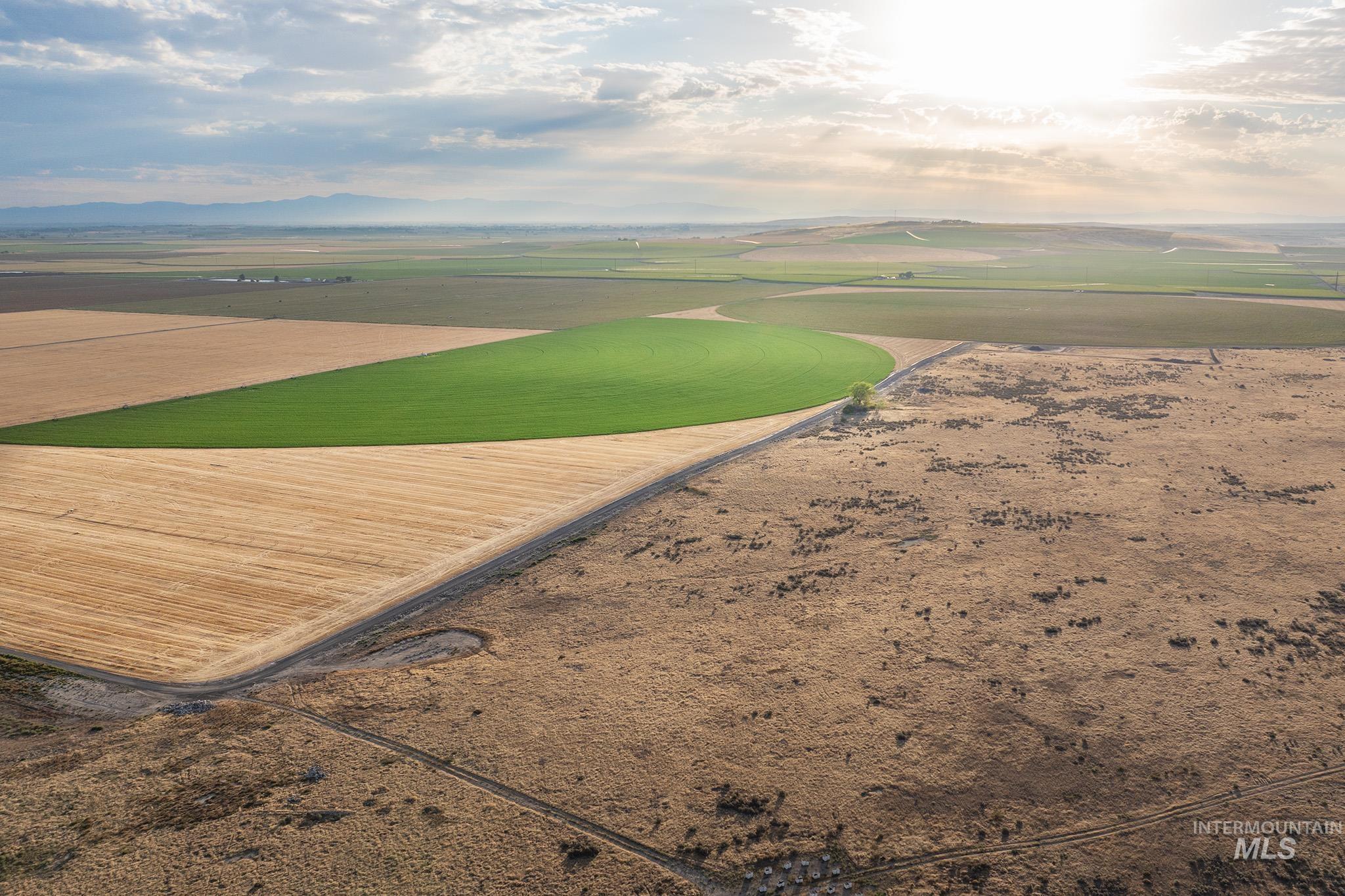 Aerial overview of property's location with rural landscape and farmland
