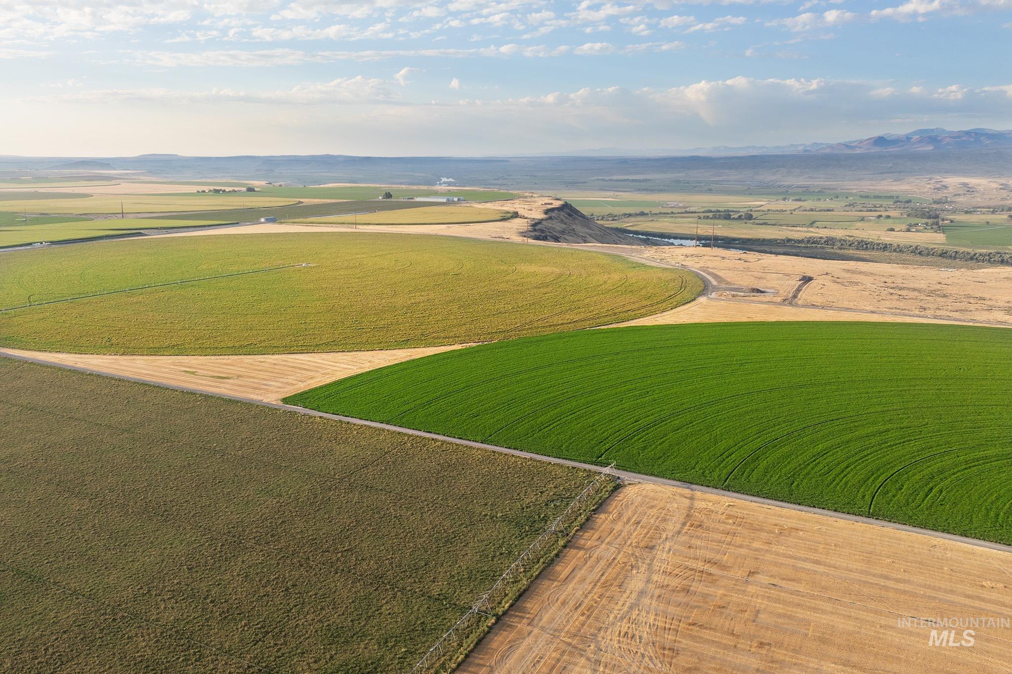 View of rural area featuring mountains and abundant farmland