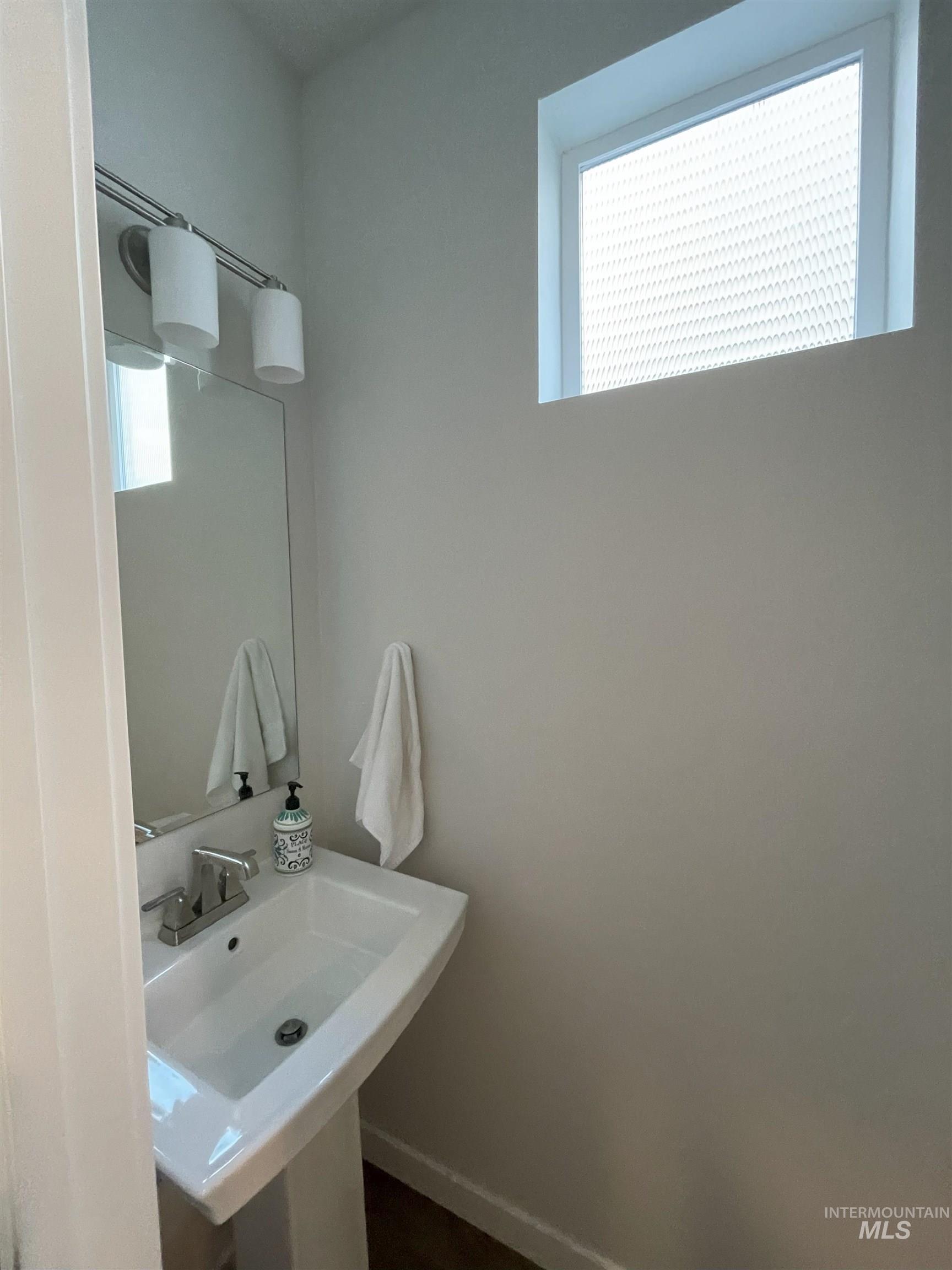 Half bathroom featuring a sink