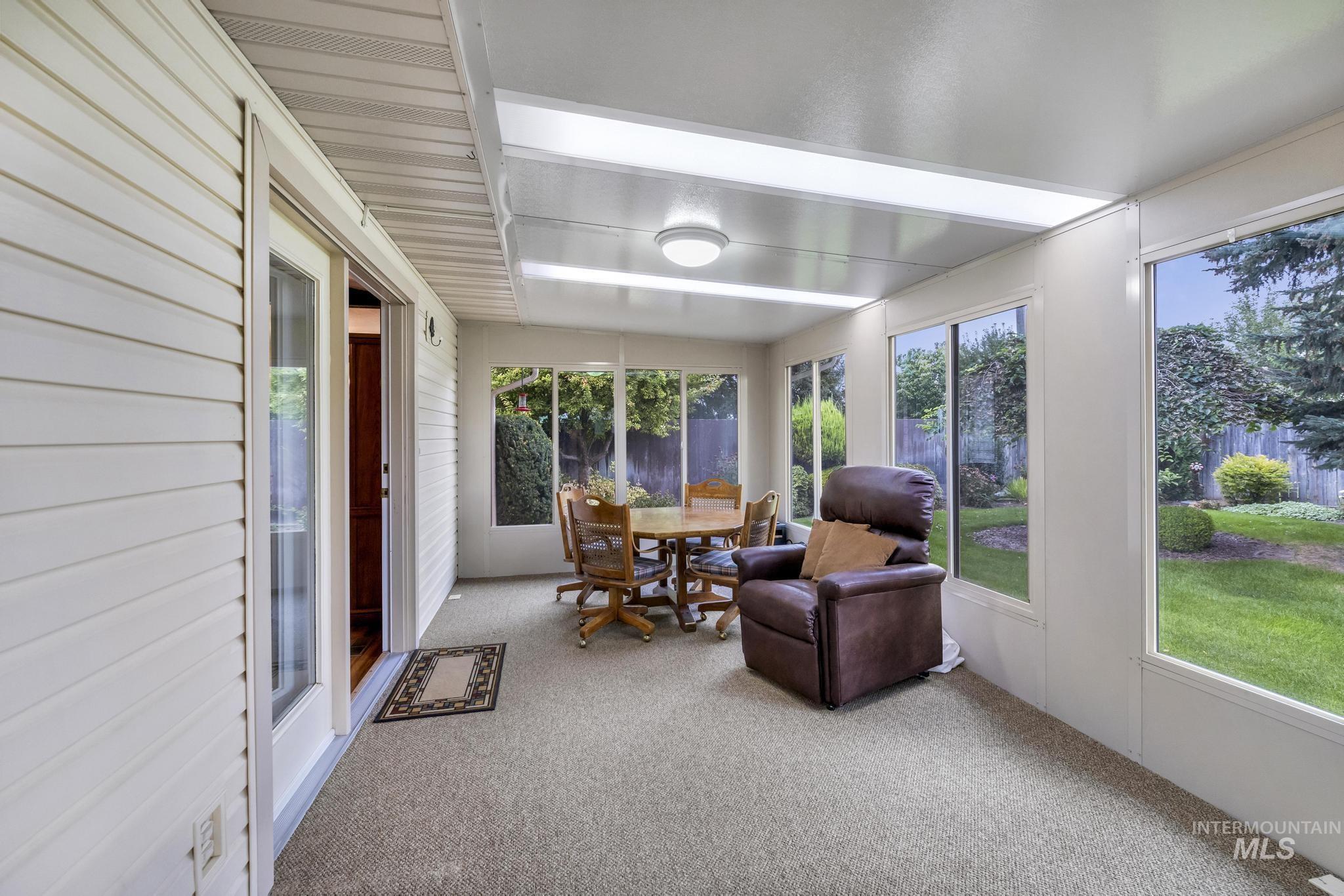 Sunroom / solarium with carpet floors