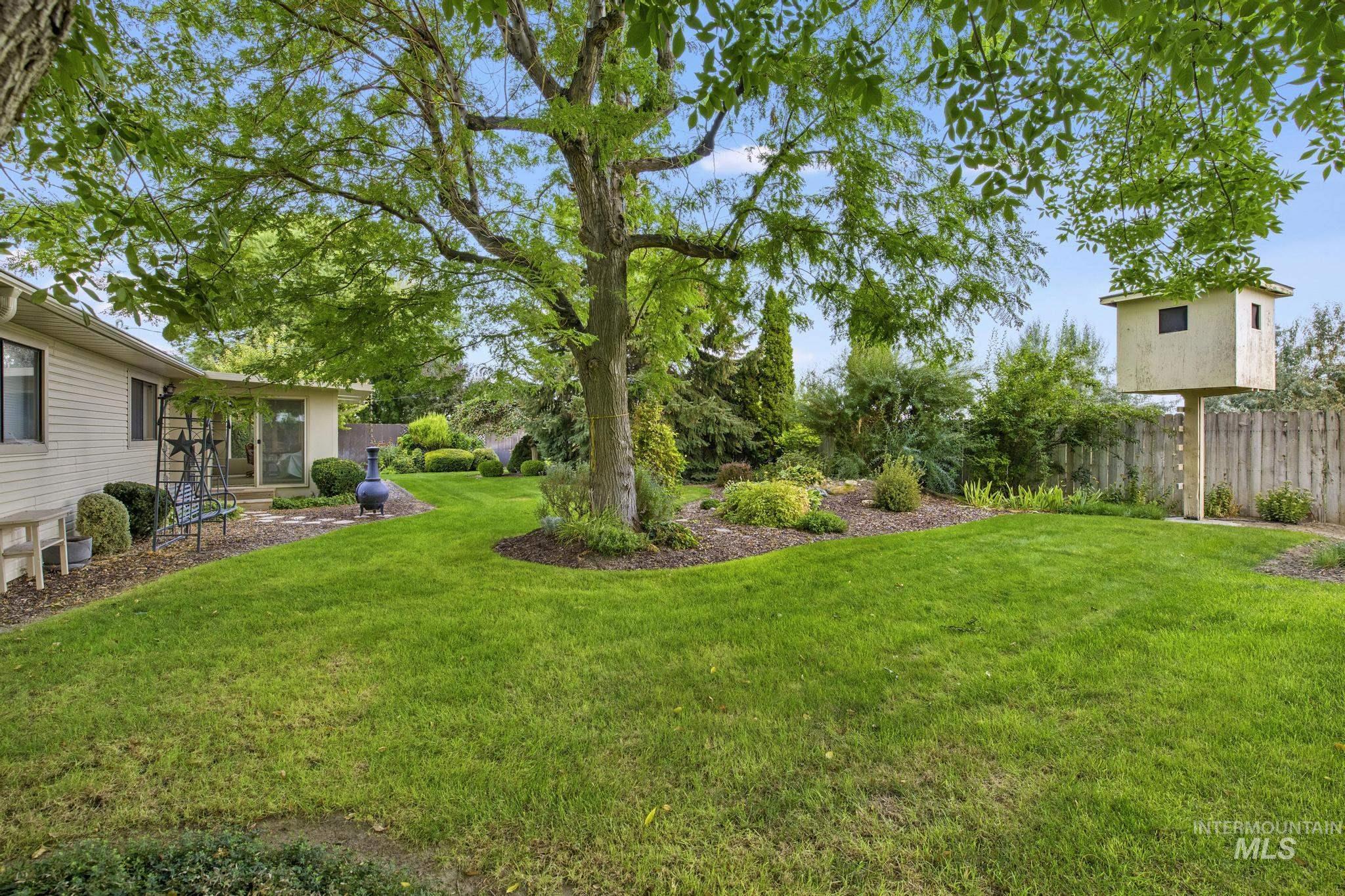 View of yard featuring a sunroom