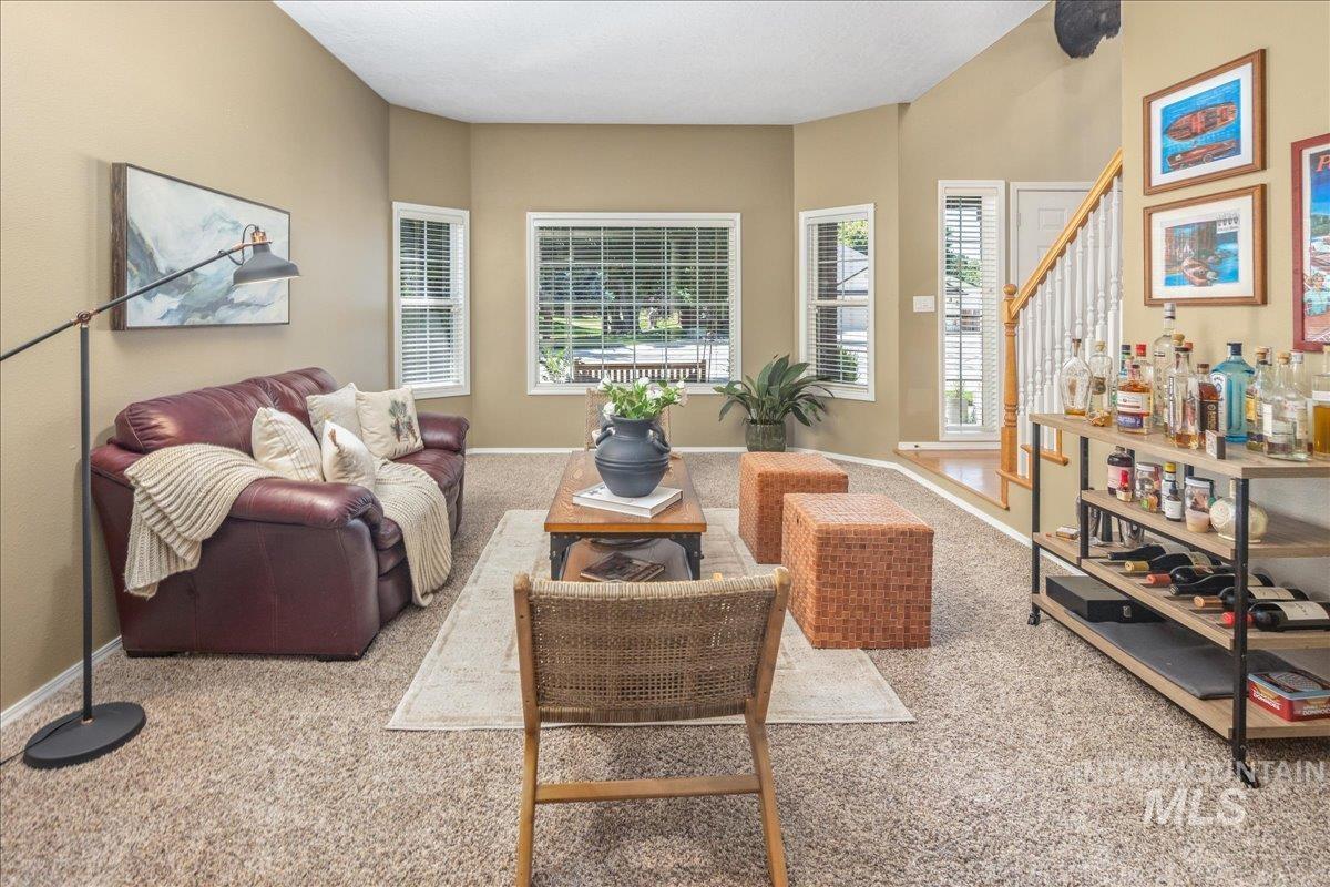 Living area with carpet and baseboards