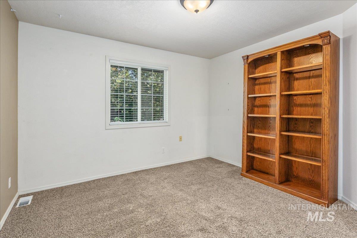 Empty room featuring carpet flooring