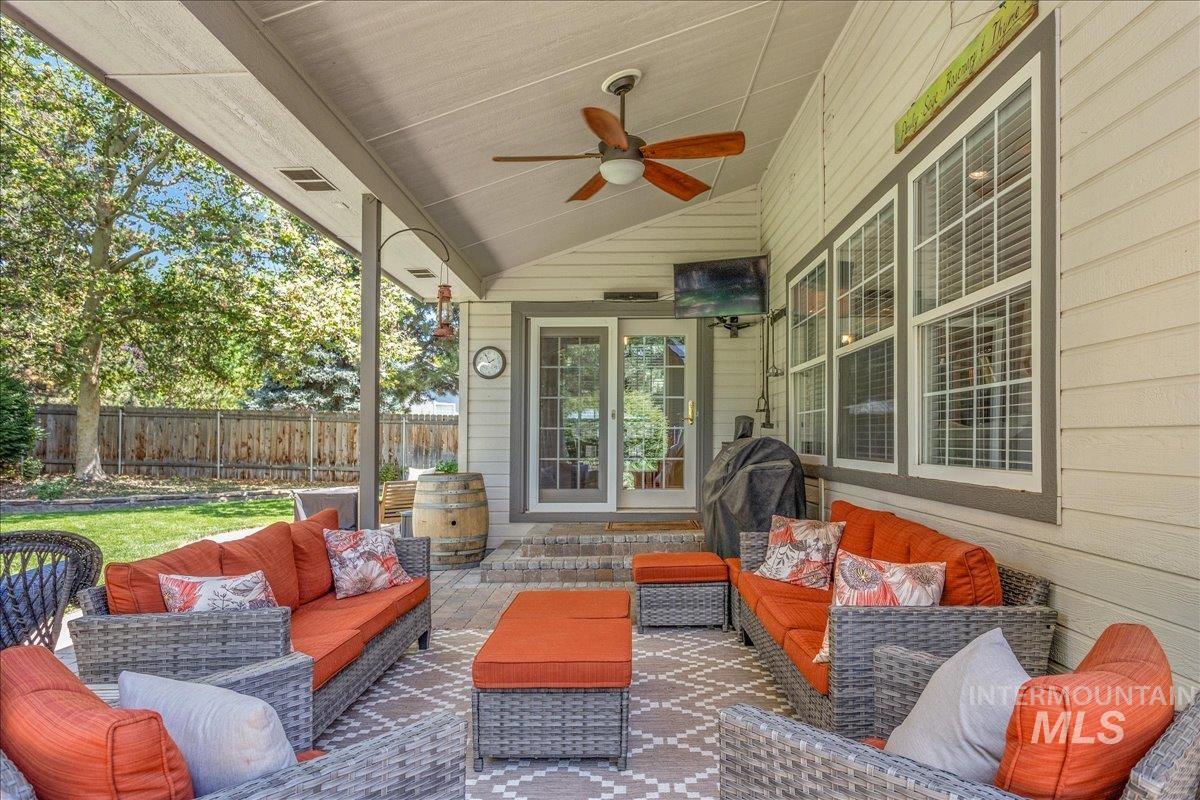 View of patio / terrace featuring an outdoor living space and ceiling fan