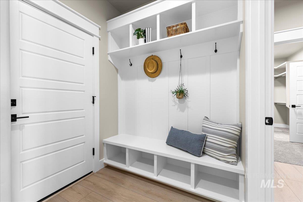 Mudroom with light wood-style flooring