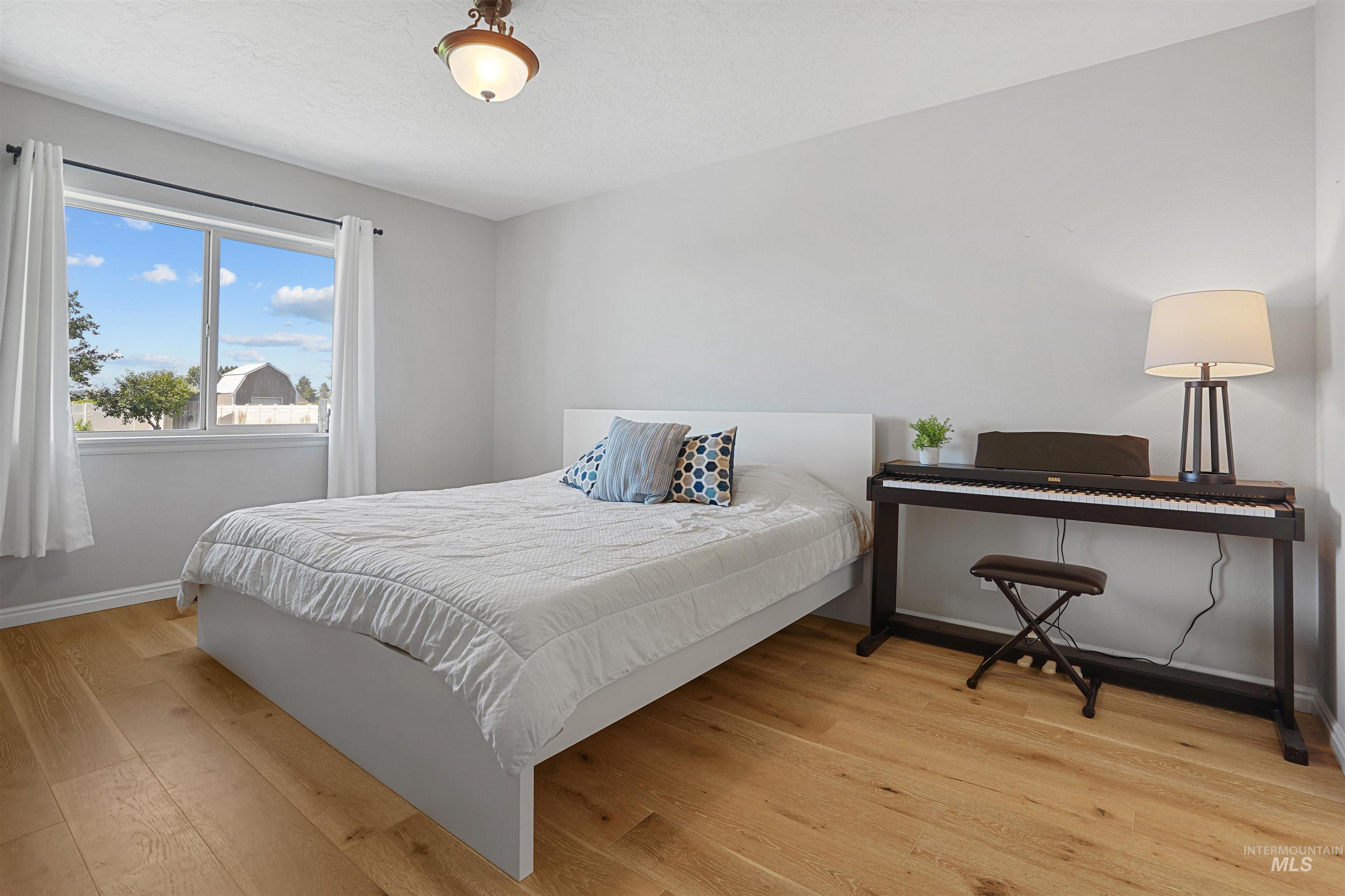 Bedroom featuring light wood-style flooring