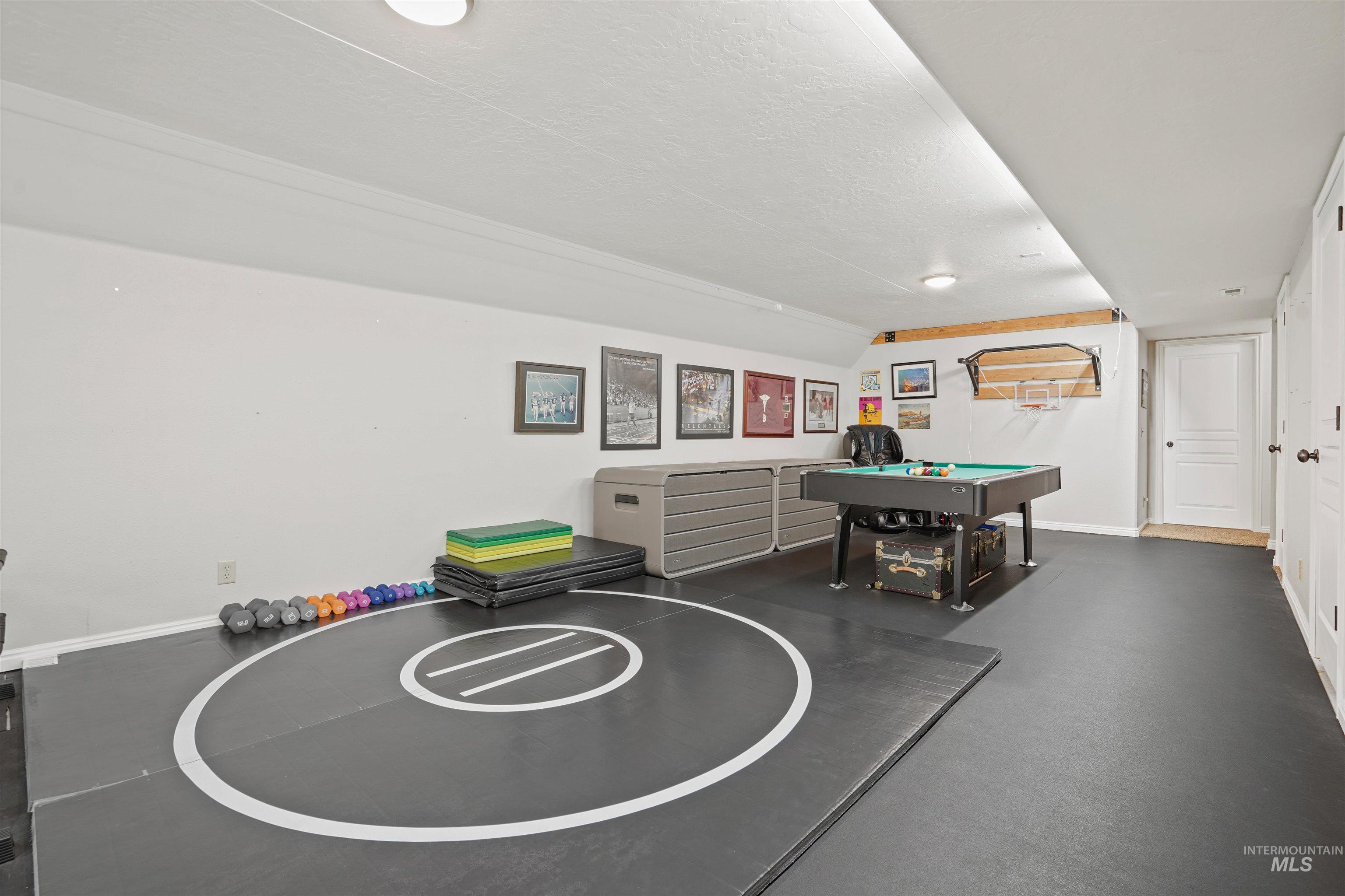 Recreation room featuring a textured ceiling and billiards