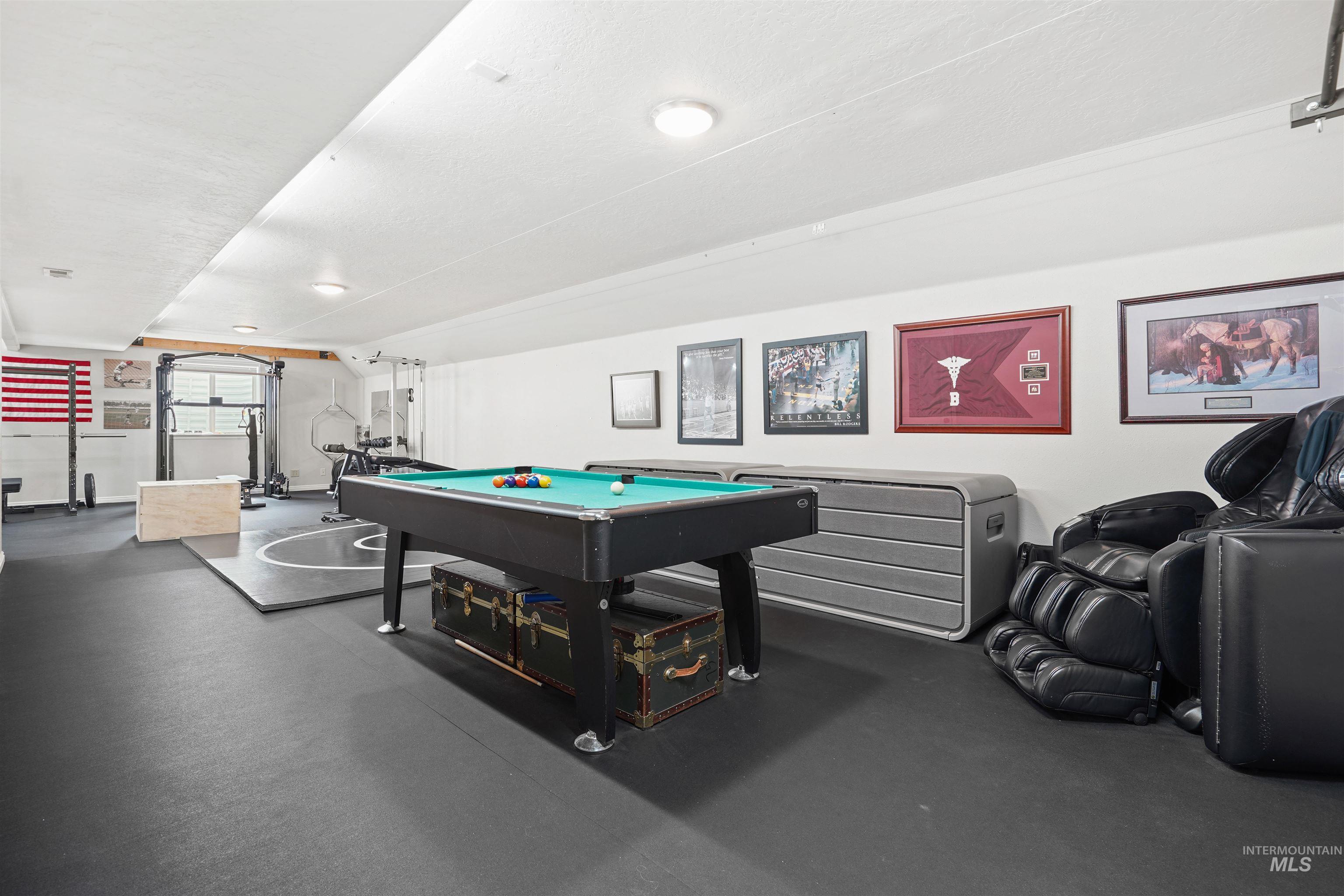 Playroom with billiards table and dark rubber floors