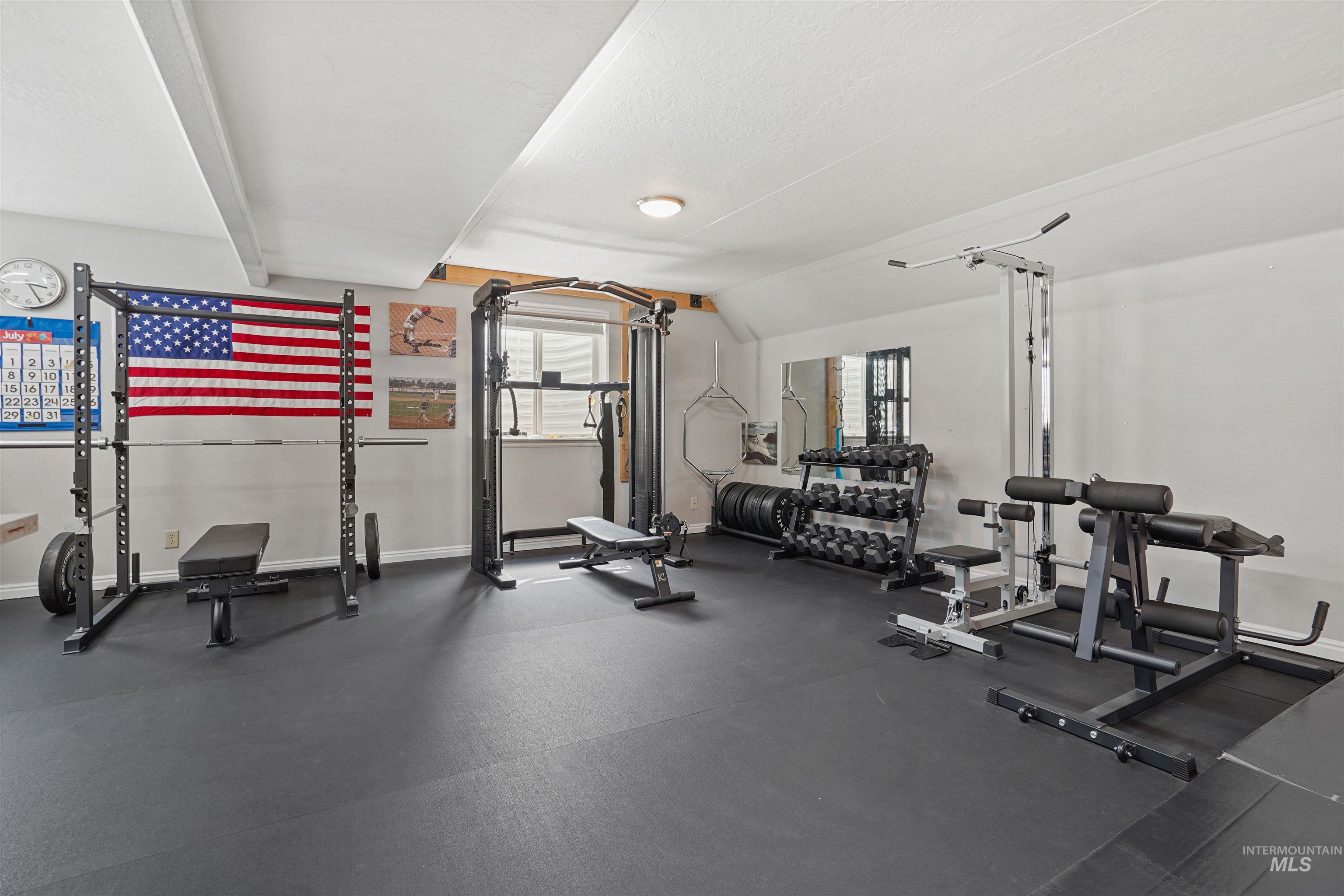 Workout area featuring lofted ceiling