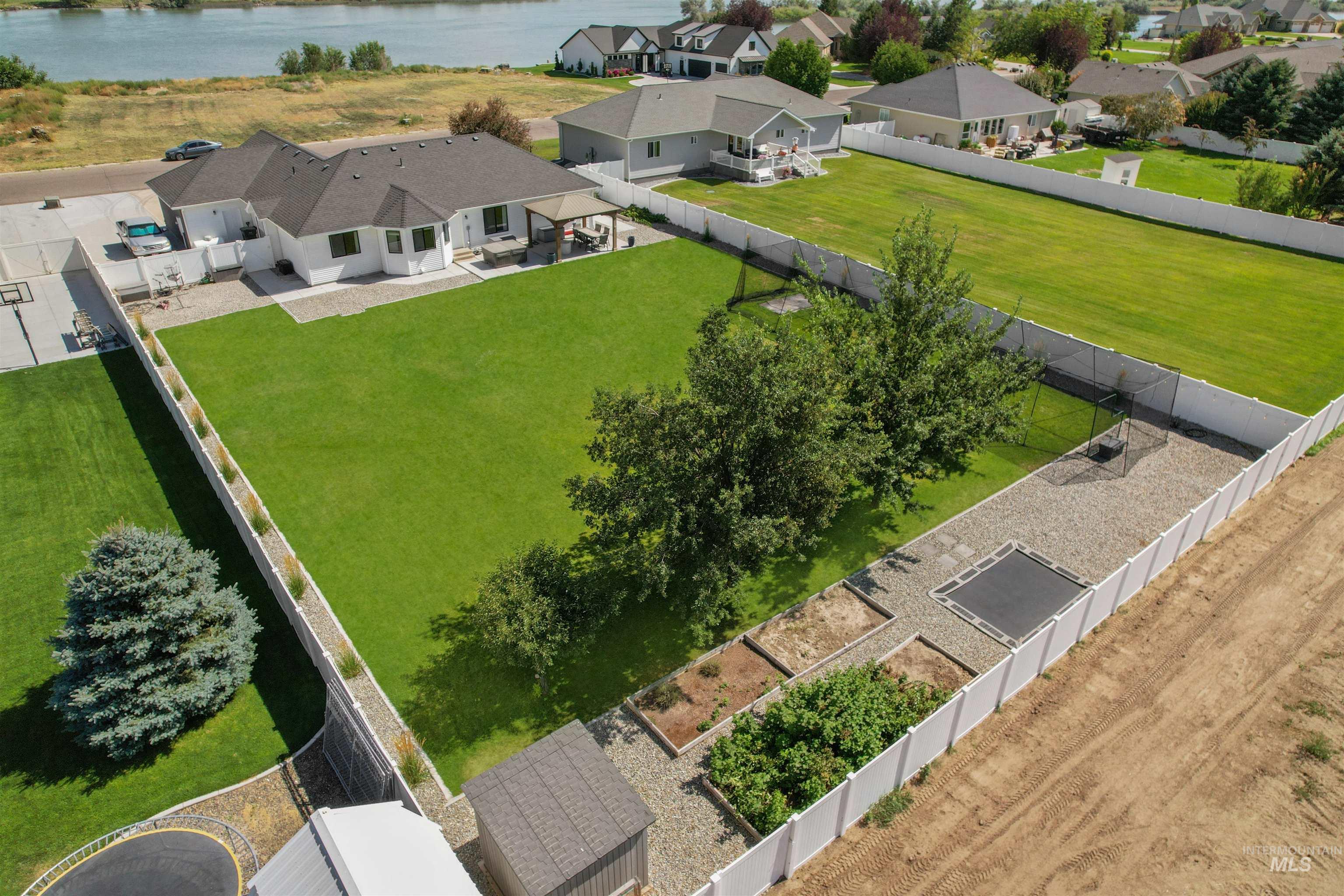 Aerial perspective of suburban area with a nearby body of water