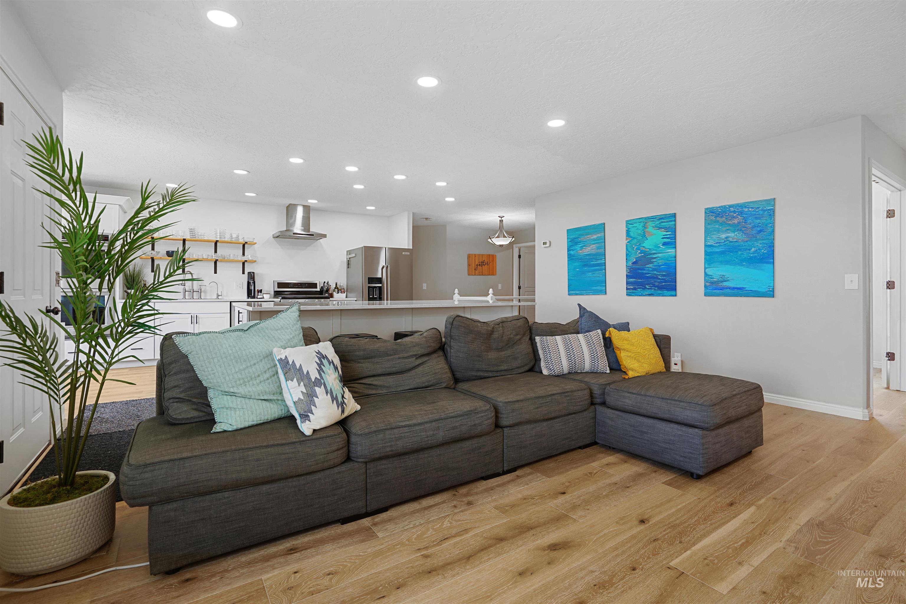 Living room featuring recessed lighting and light wood-style floors