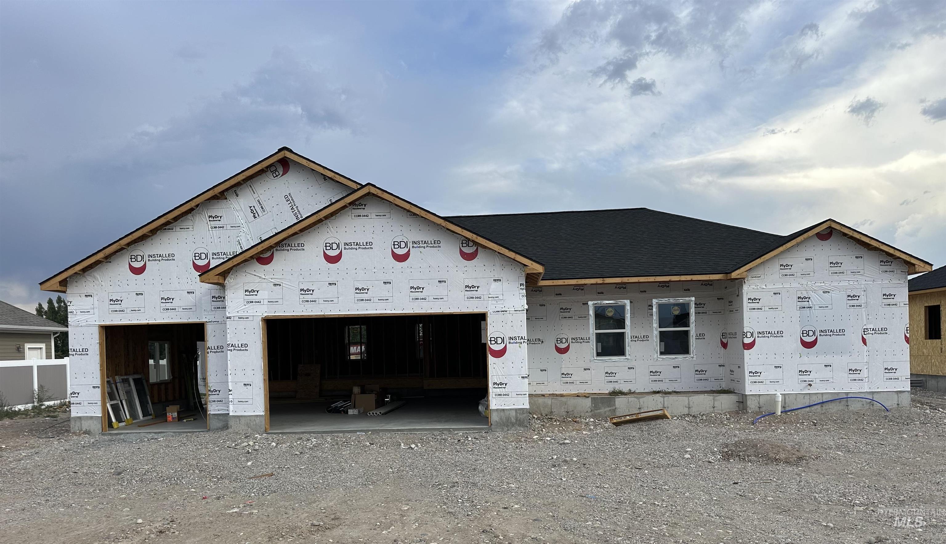 Property under construction featuring an attached garage