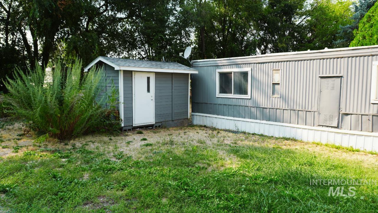 View of shed featuring view of scattered trees
