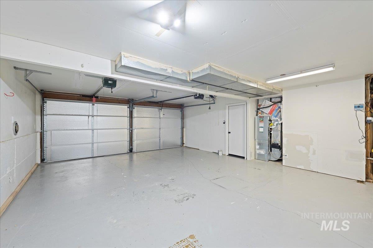 Garage featuring heating unit