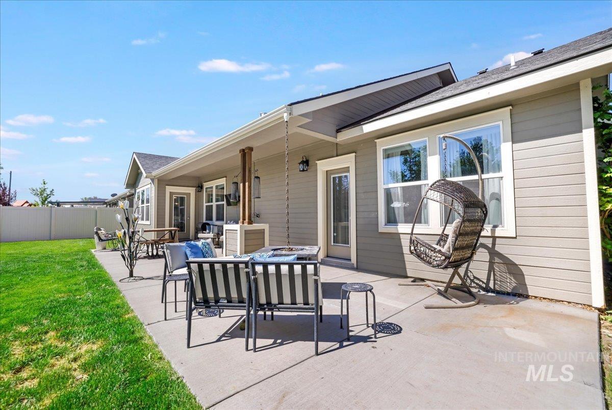 View of patio featuring an outdoor fire pit