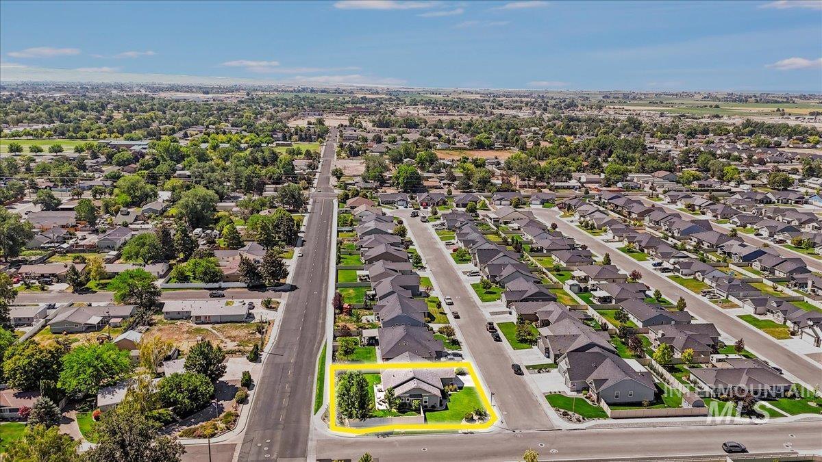 Aerial perspective of suburban area with property parcel outlined