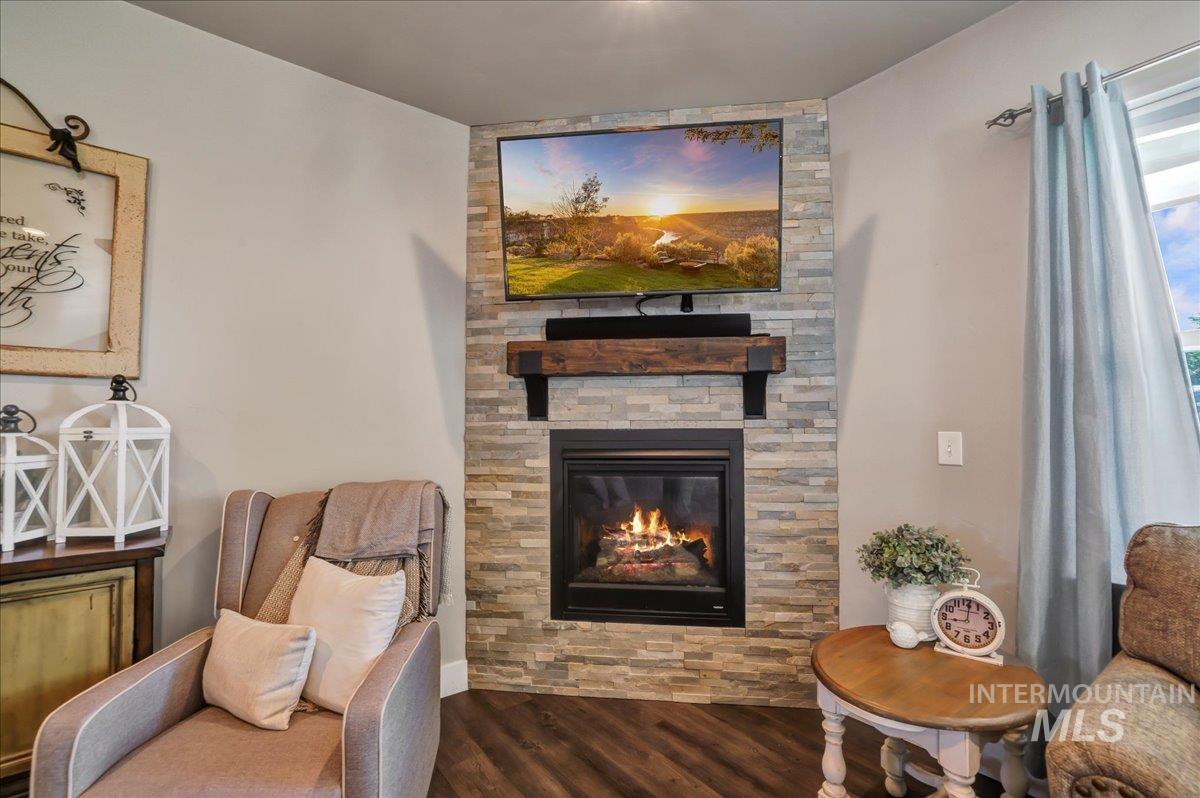 Sitting room featuring wood finished floors and a fireplace