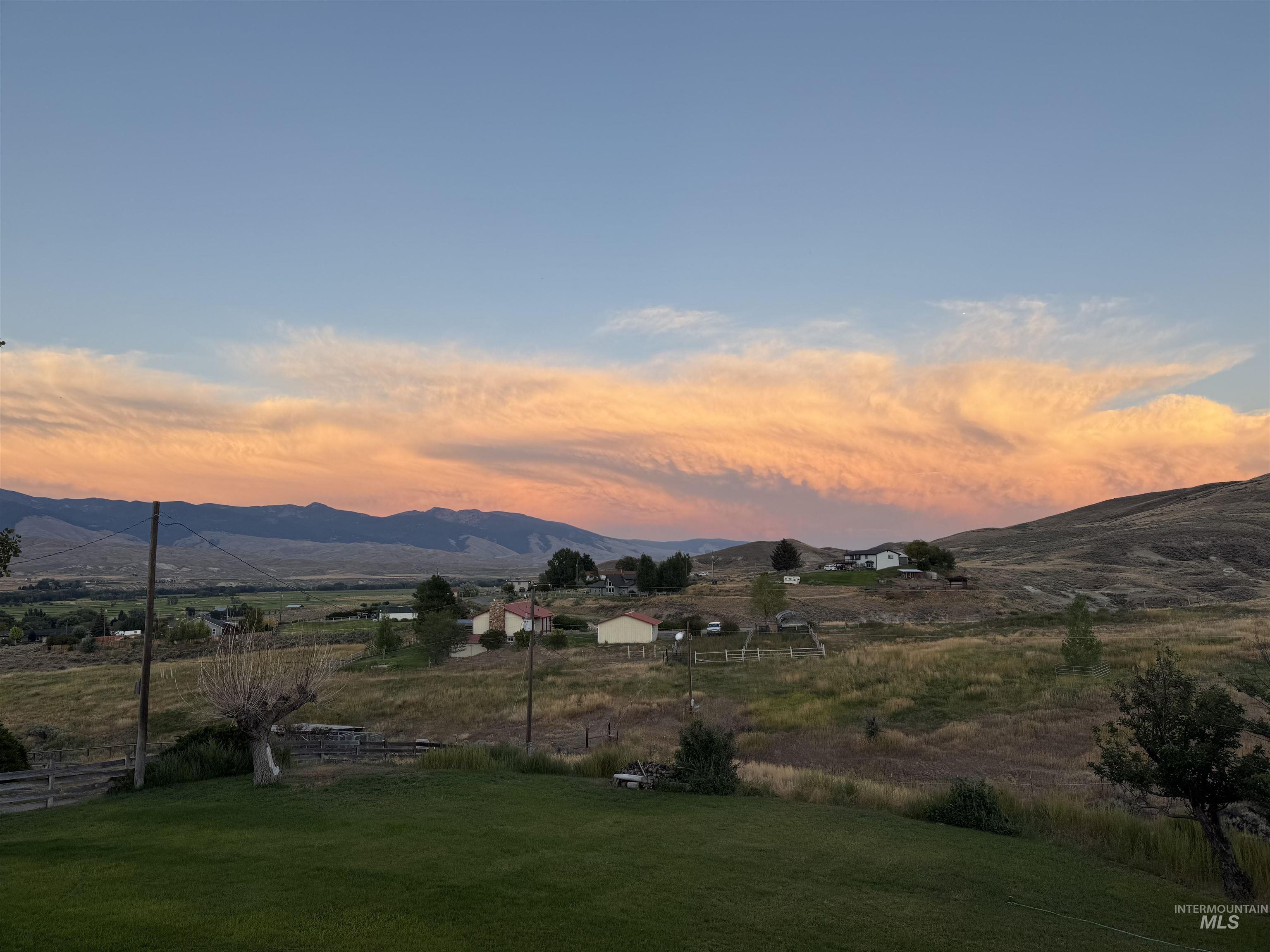 View of mountain background featuring rural landscape bordering public land