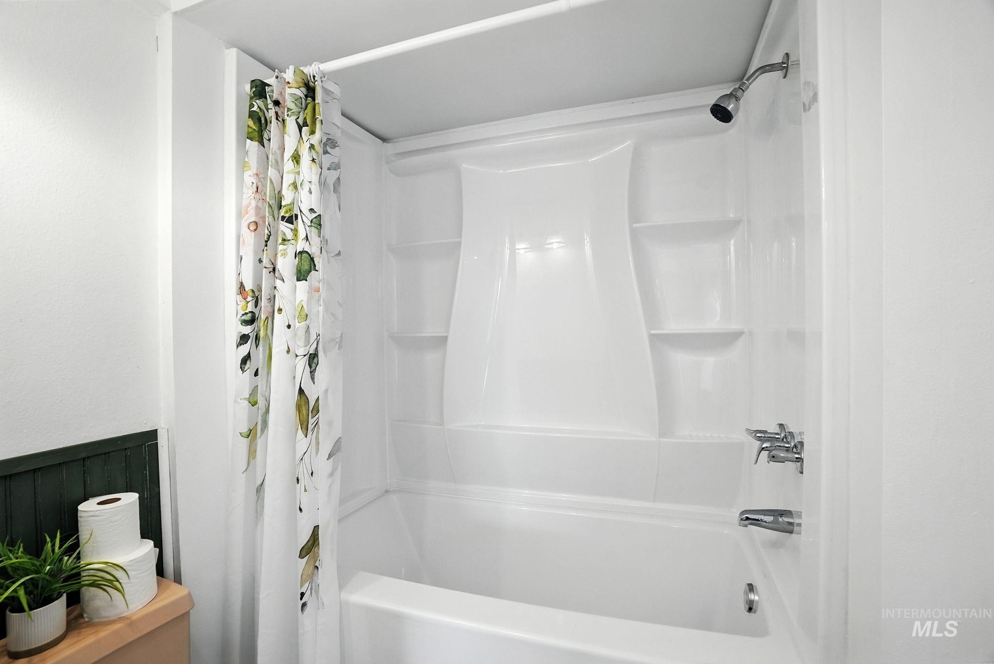 Bathroom featuring shower / tub combo