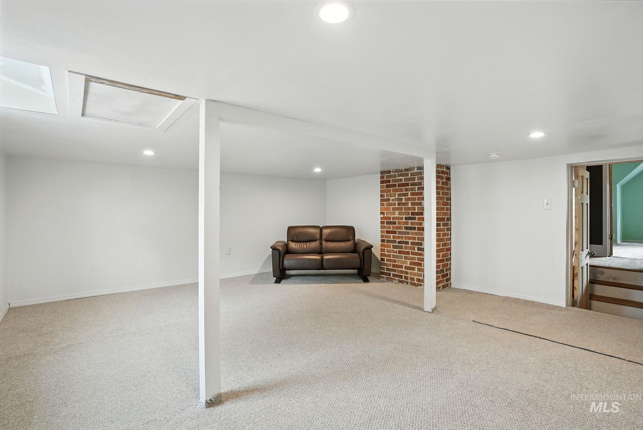 Basement with carpet flooring and recessed lighting