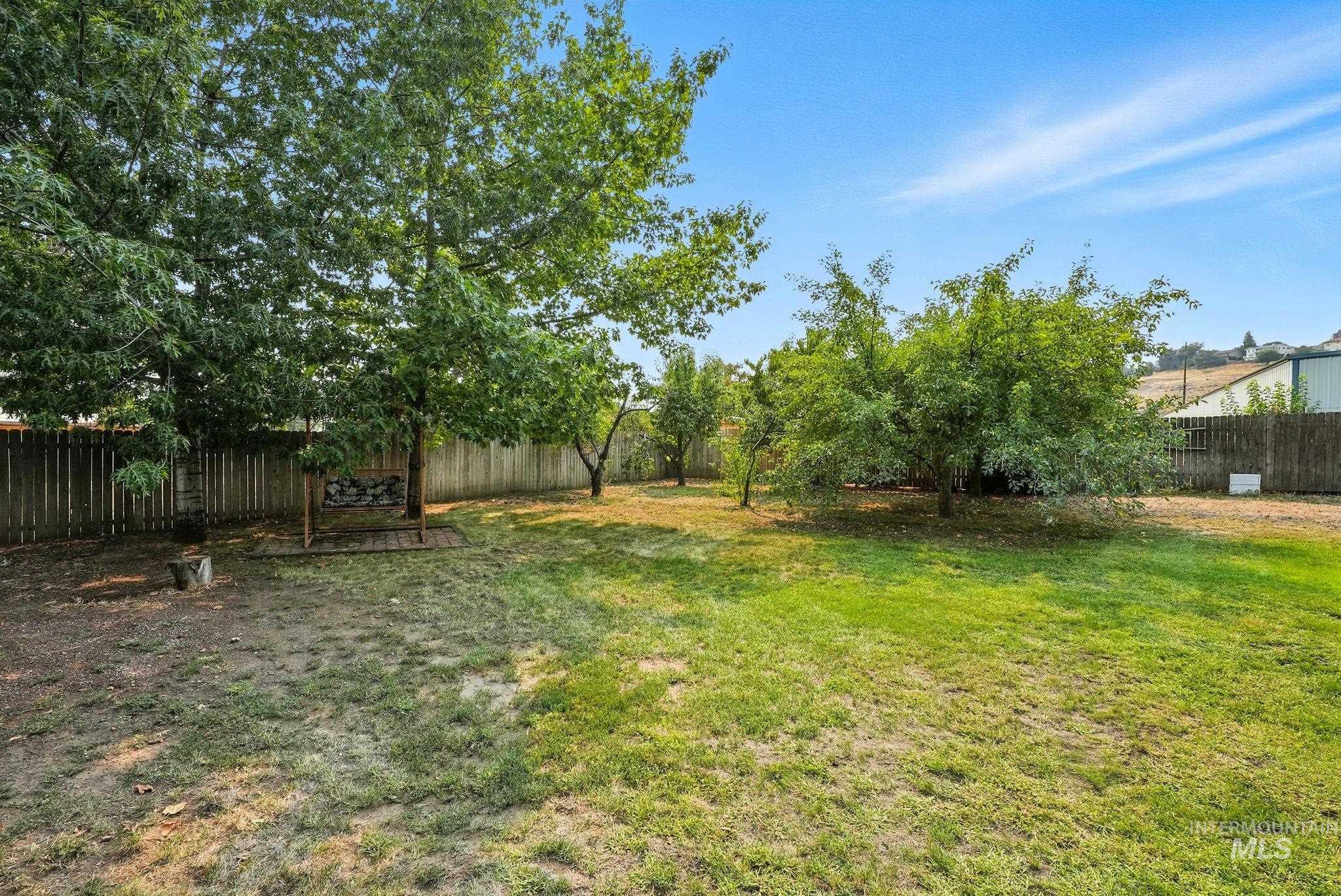View of fenced backyard