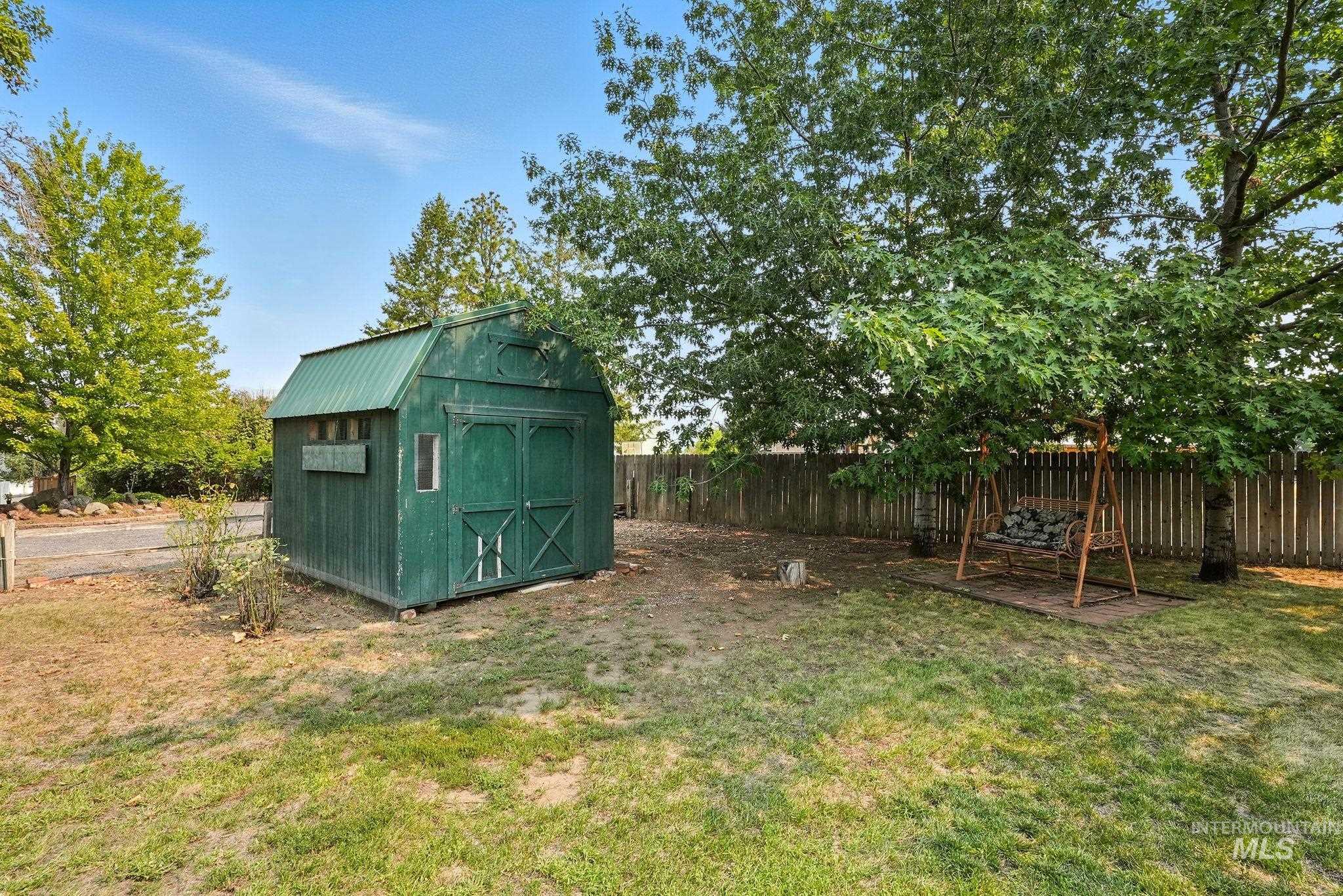 View of shed with a fenced backyard