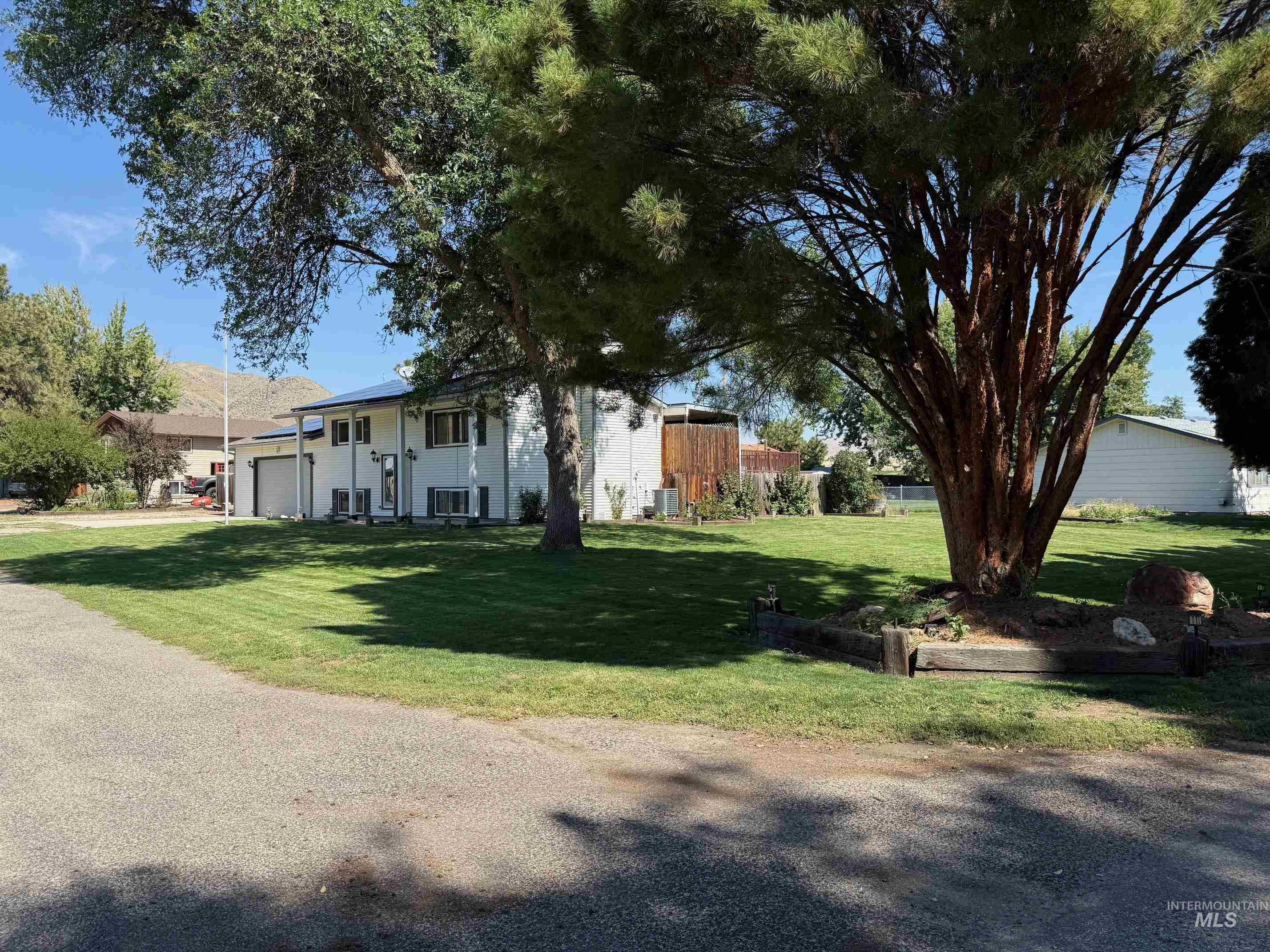 View of grassy yard with an attached garage