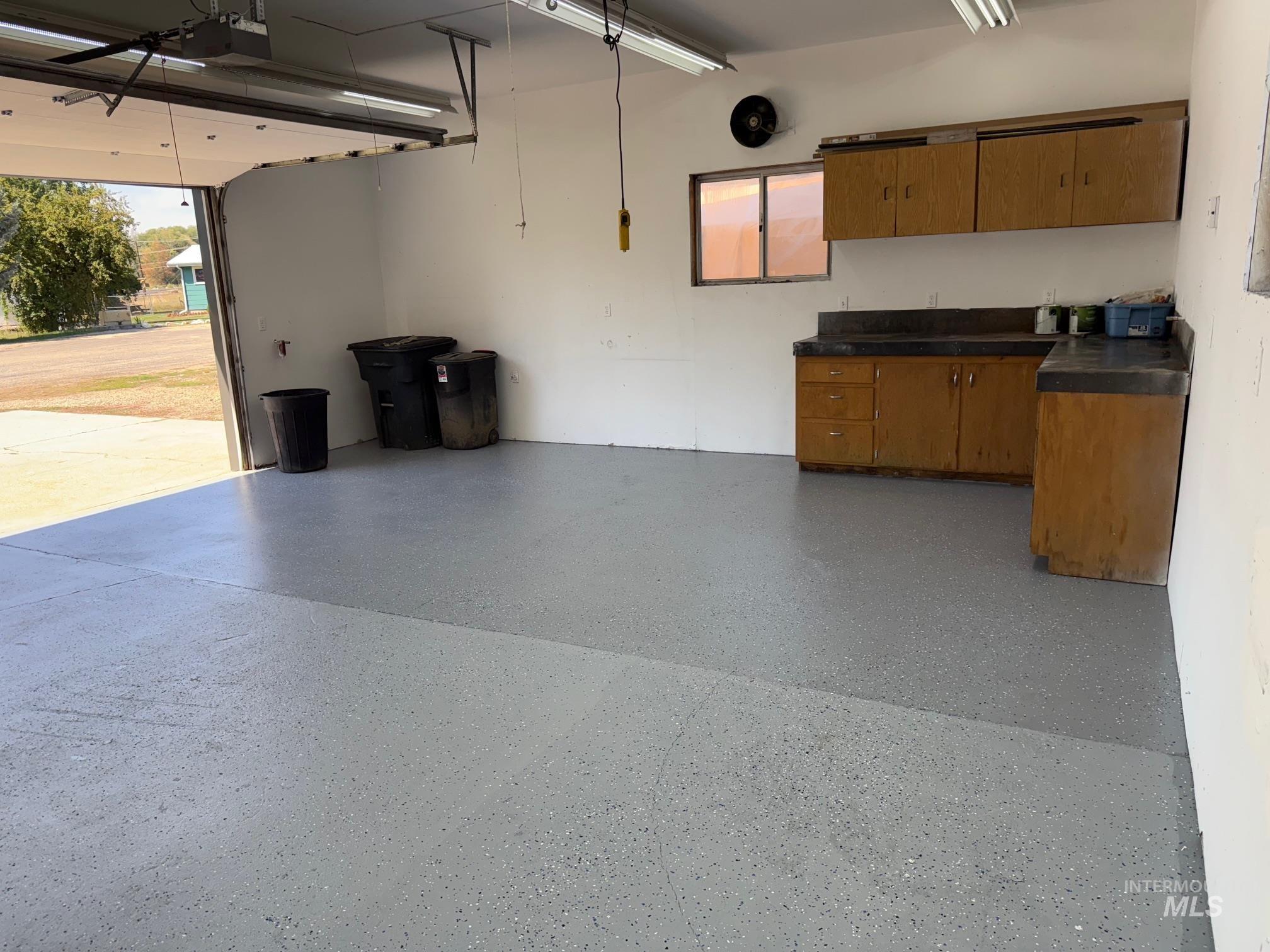 Garage featuring a garage door opener