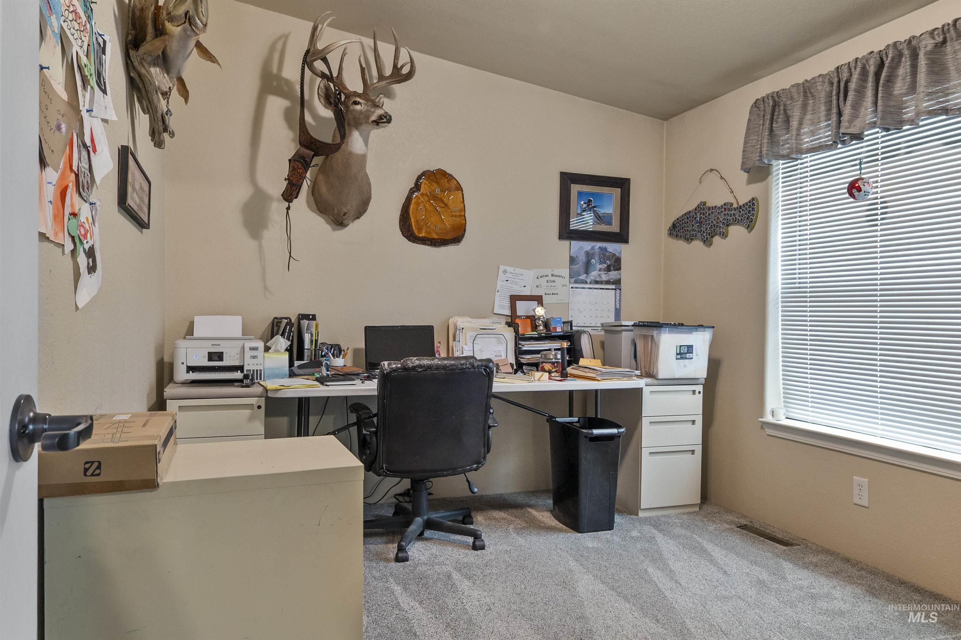 Office featuring light colored carpet