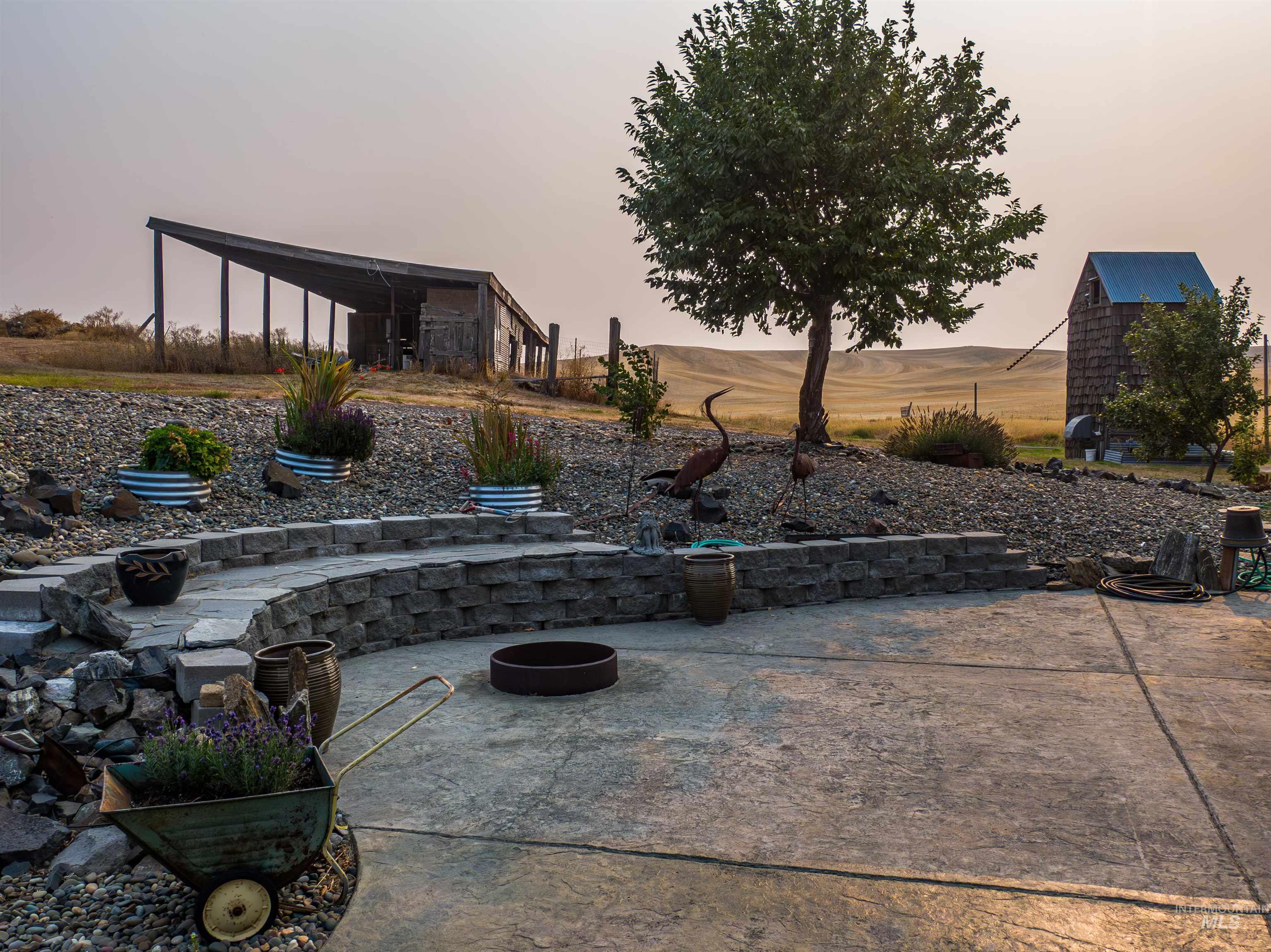 Patio terrace at dusk featuring a patio