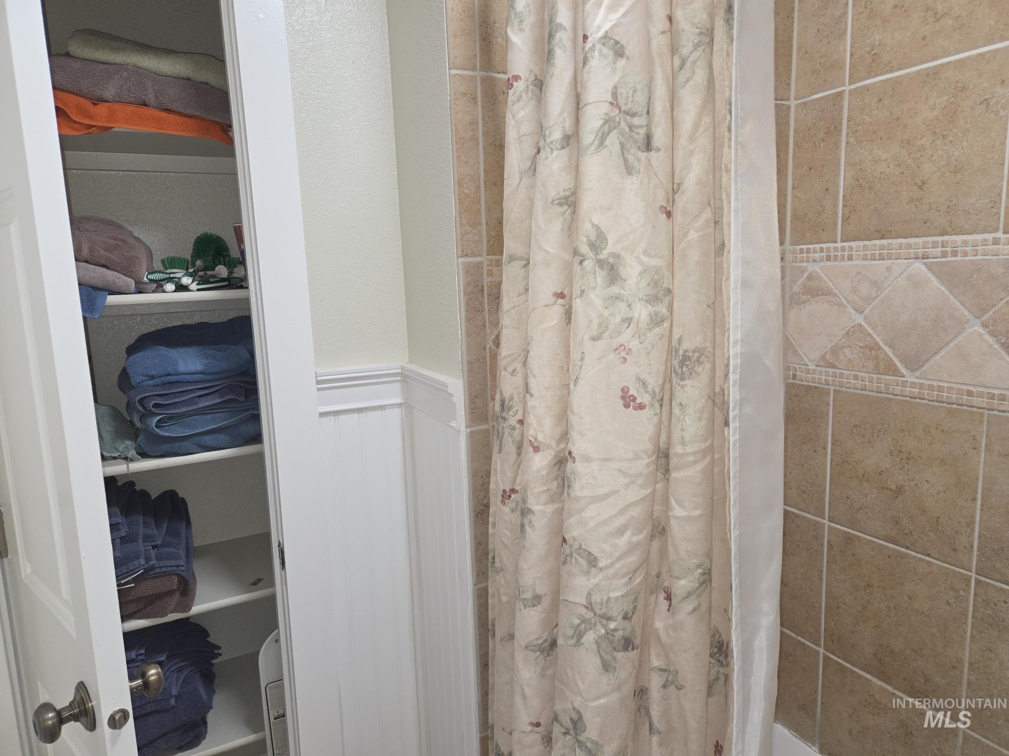 Full bath featuring curtained shower