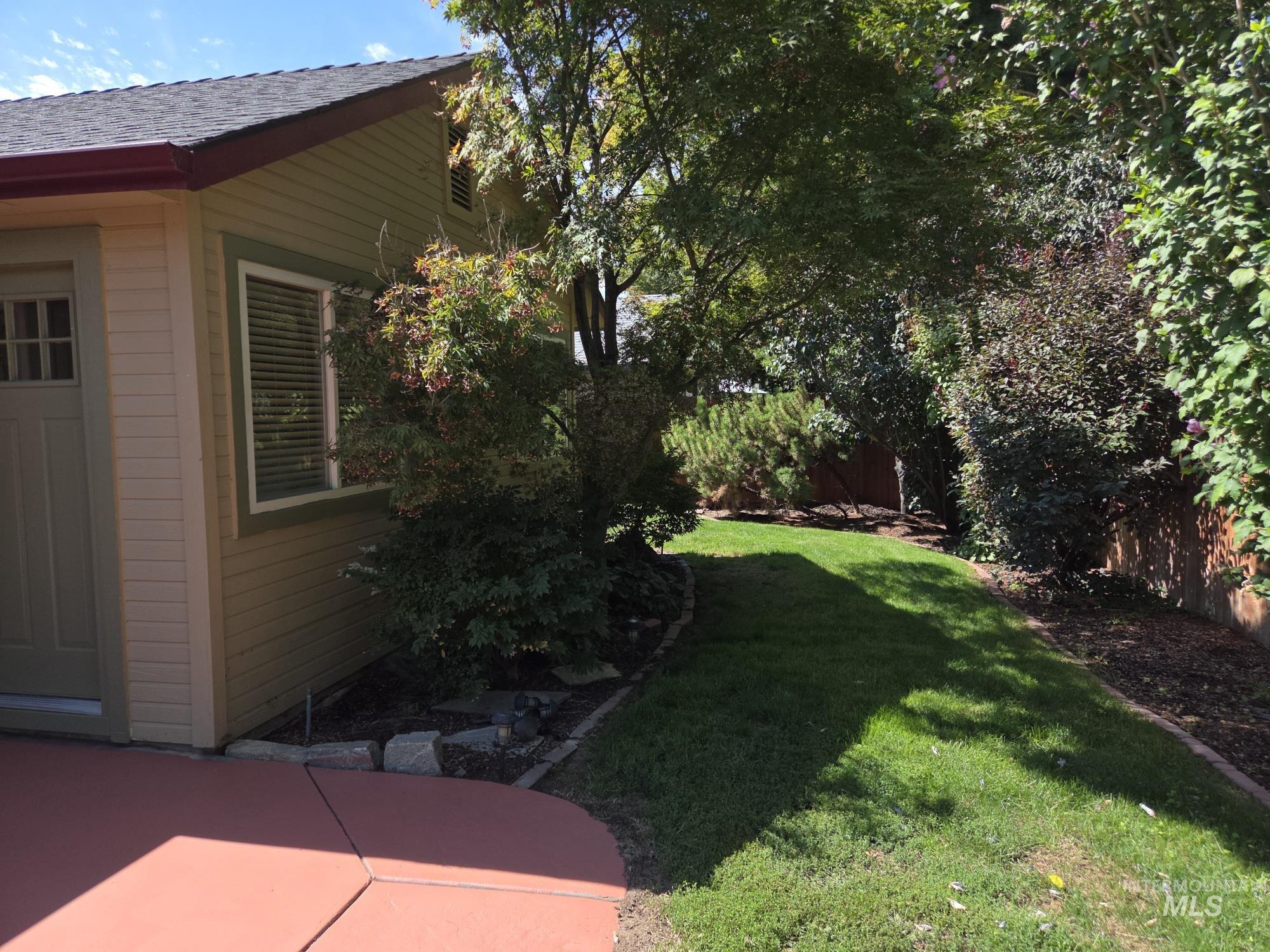 View of yard with a patio