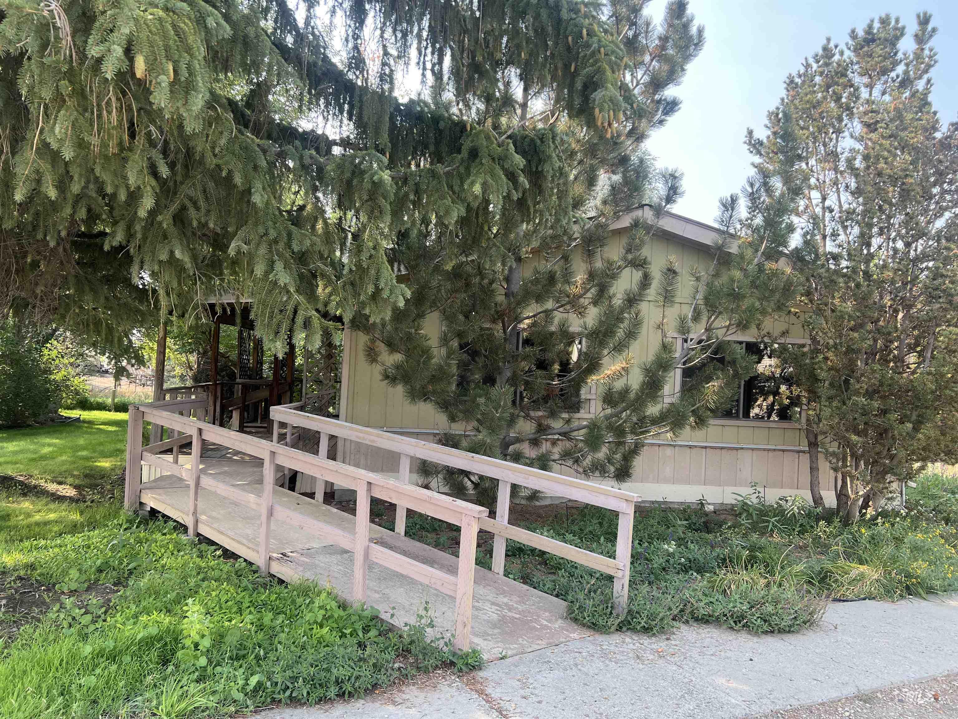 View of side of home with handicapped ramp
