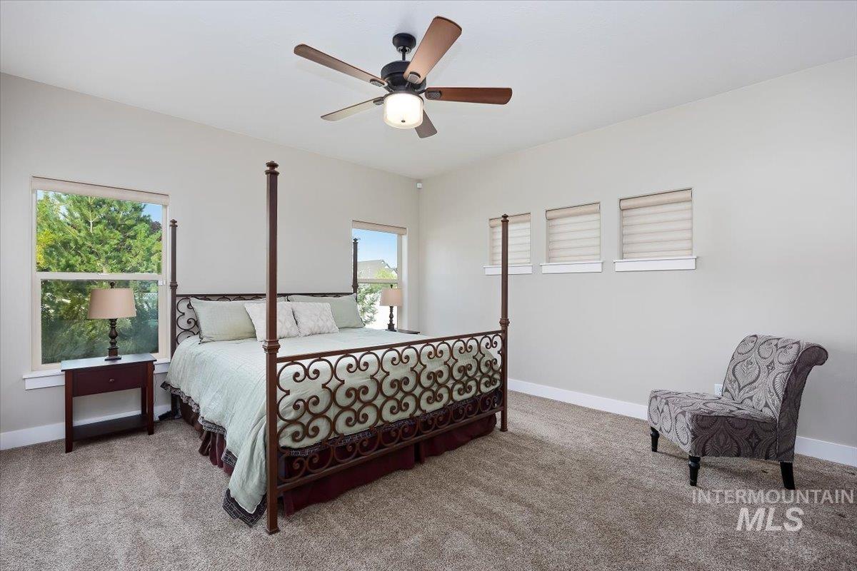 Bedroom featuring carpet flooring and a ceiling fan