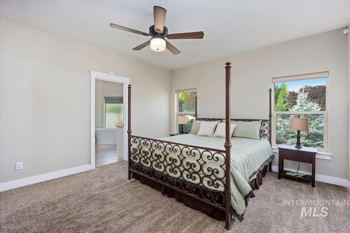 Bedroom featuring carpet floors and a ceiling fan