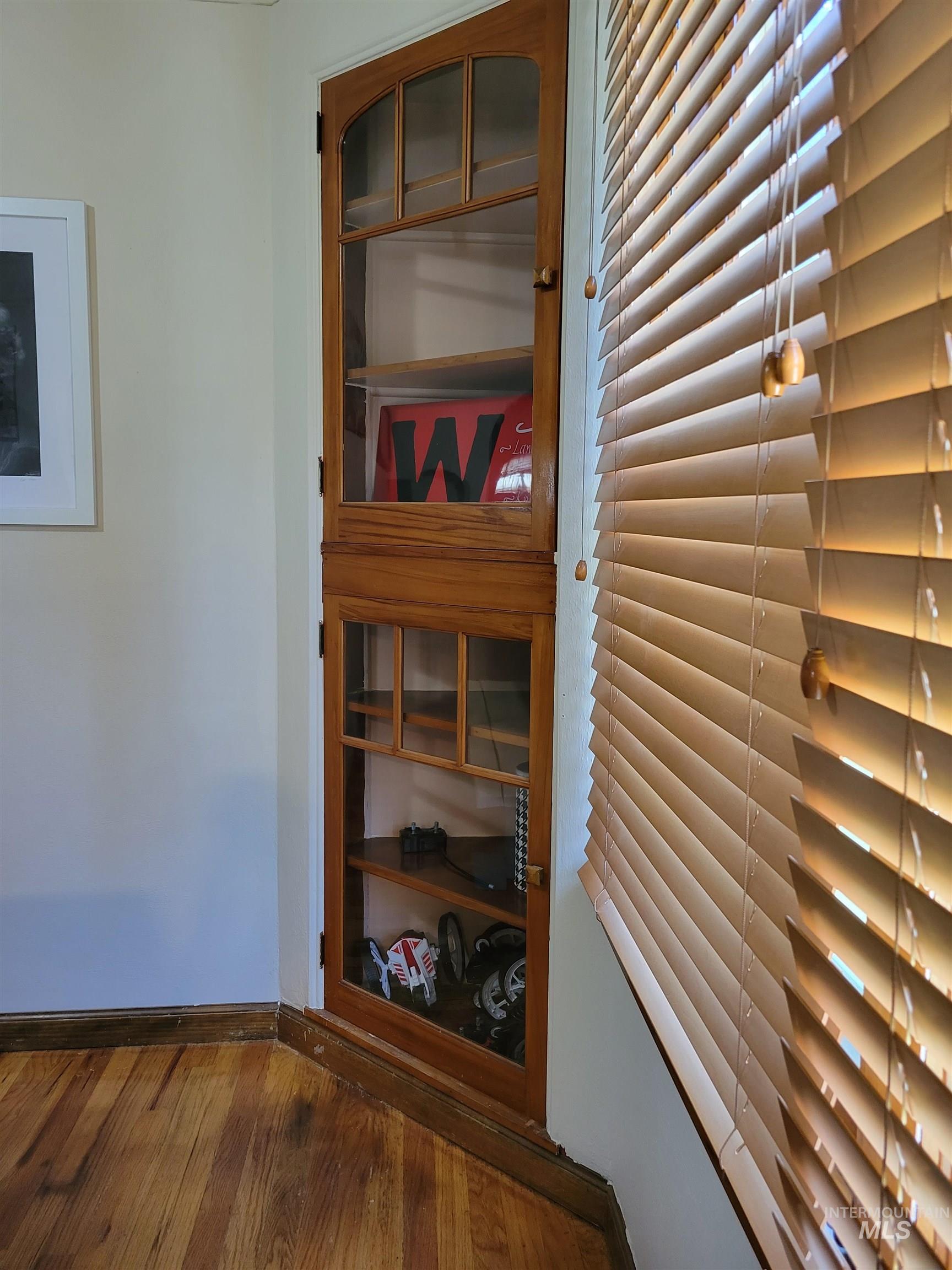 Detailed view of baseboards and wood finished floors