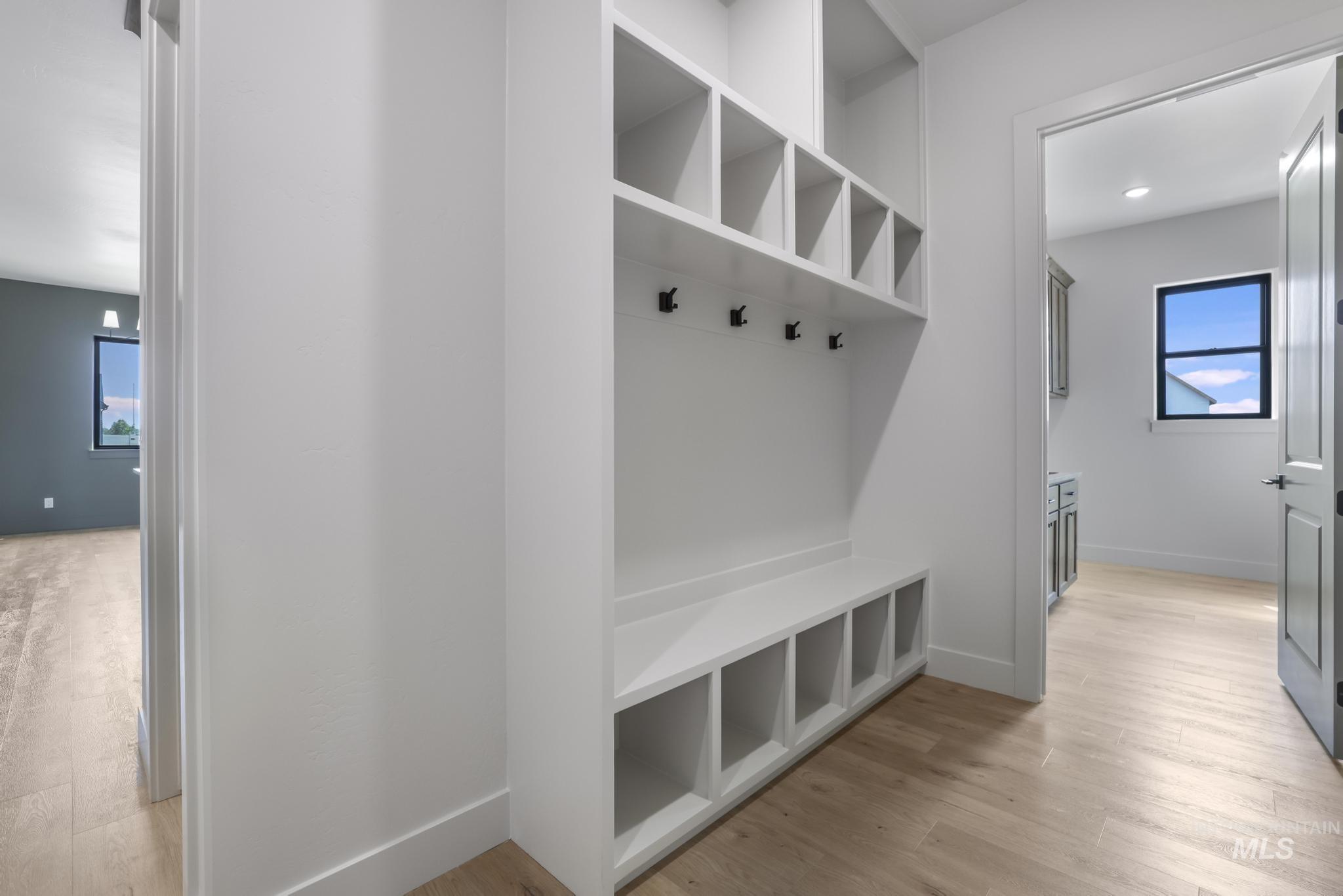 Mudroom with light wood-style floors