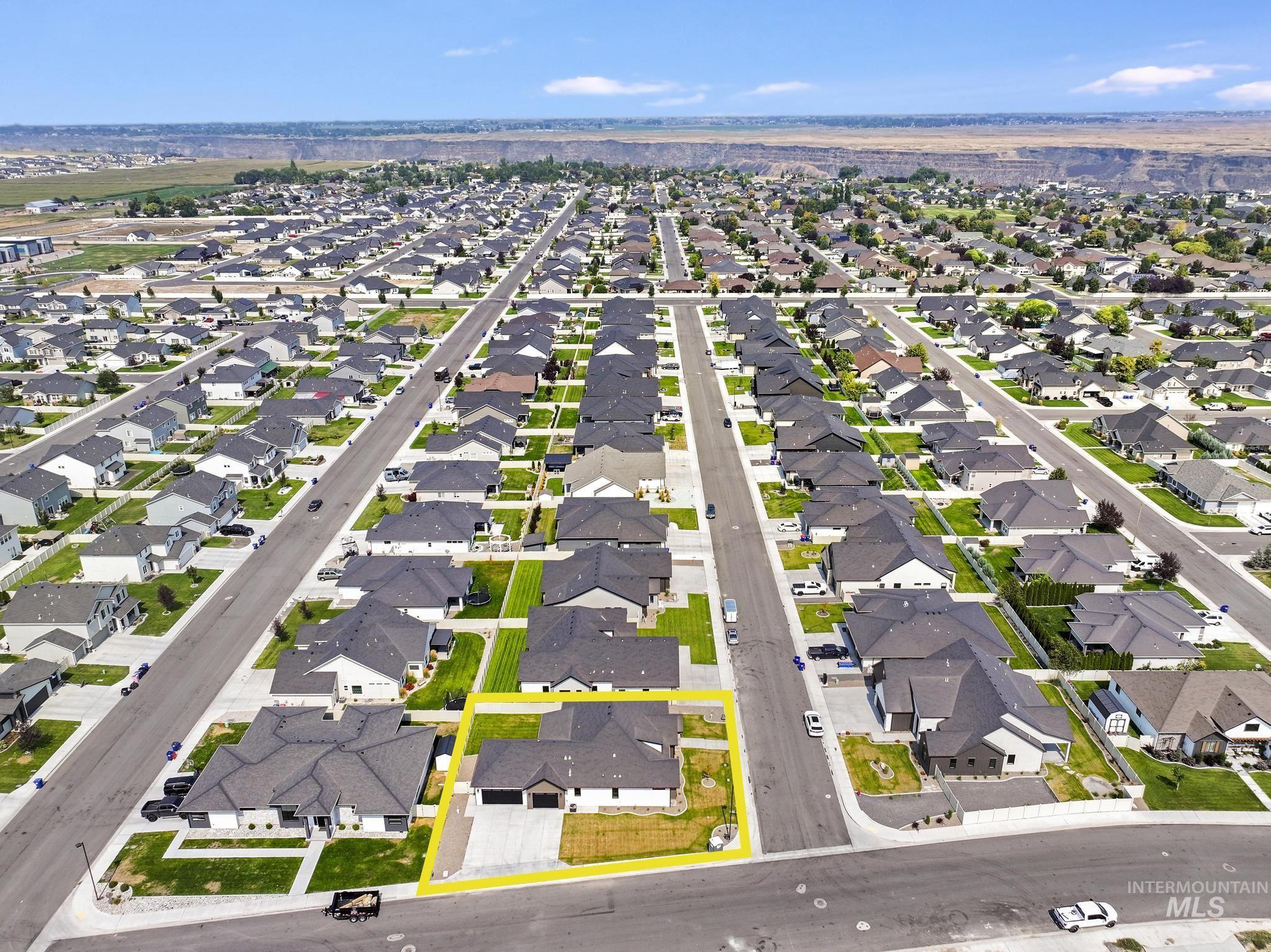 View of property location featuring property parcel outlined and nearby suburban area