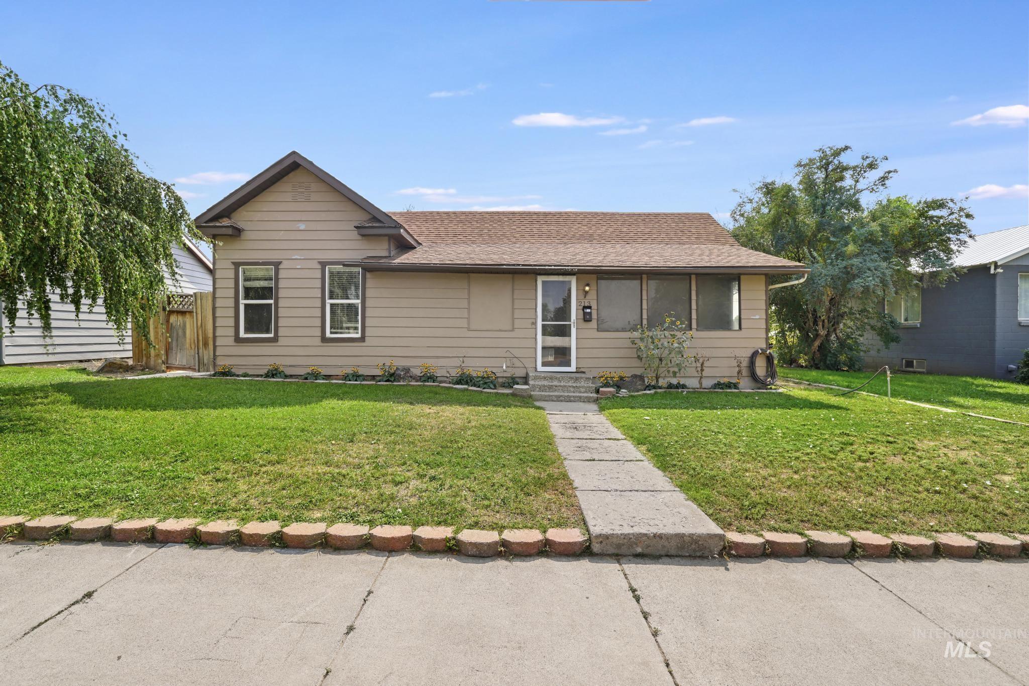 View of front of property featuring roof with shingles and entry steps