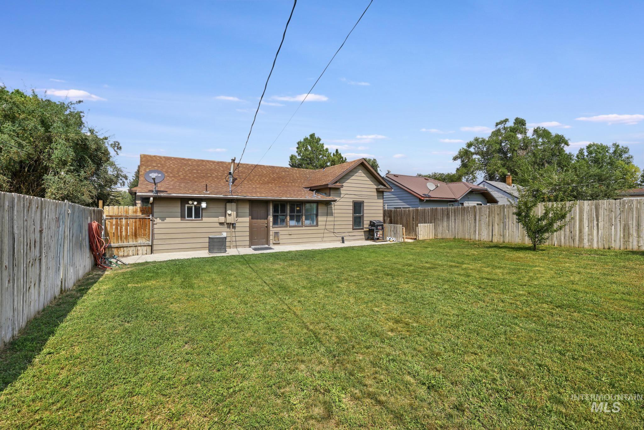 Back of house featuring a patio area and a fenced backyard