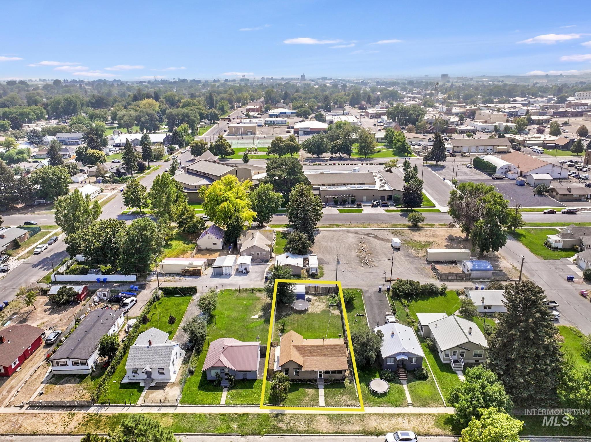 Aerial view of residential area featuring property boundaries highlighted