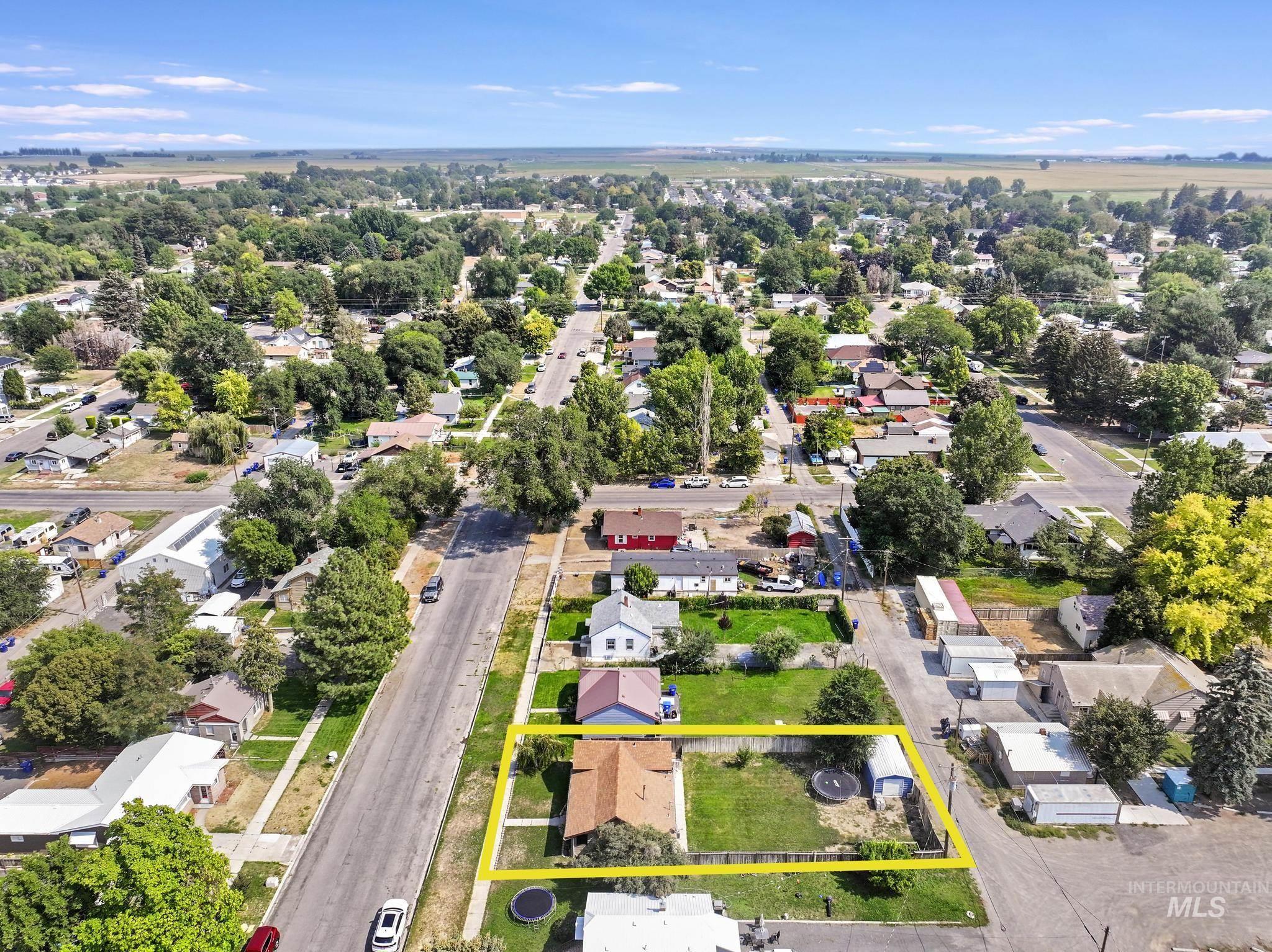 Aerial view of residential area with property parcel outlined