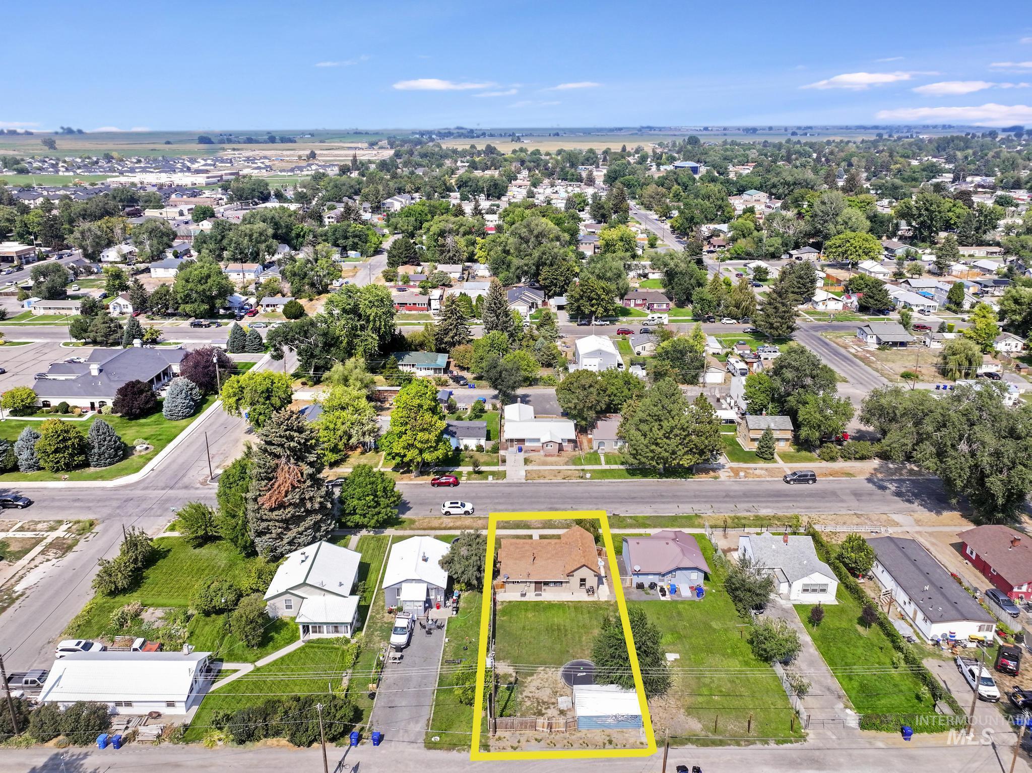 Aerial view of residential area with property parcel outlined