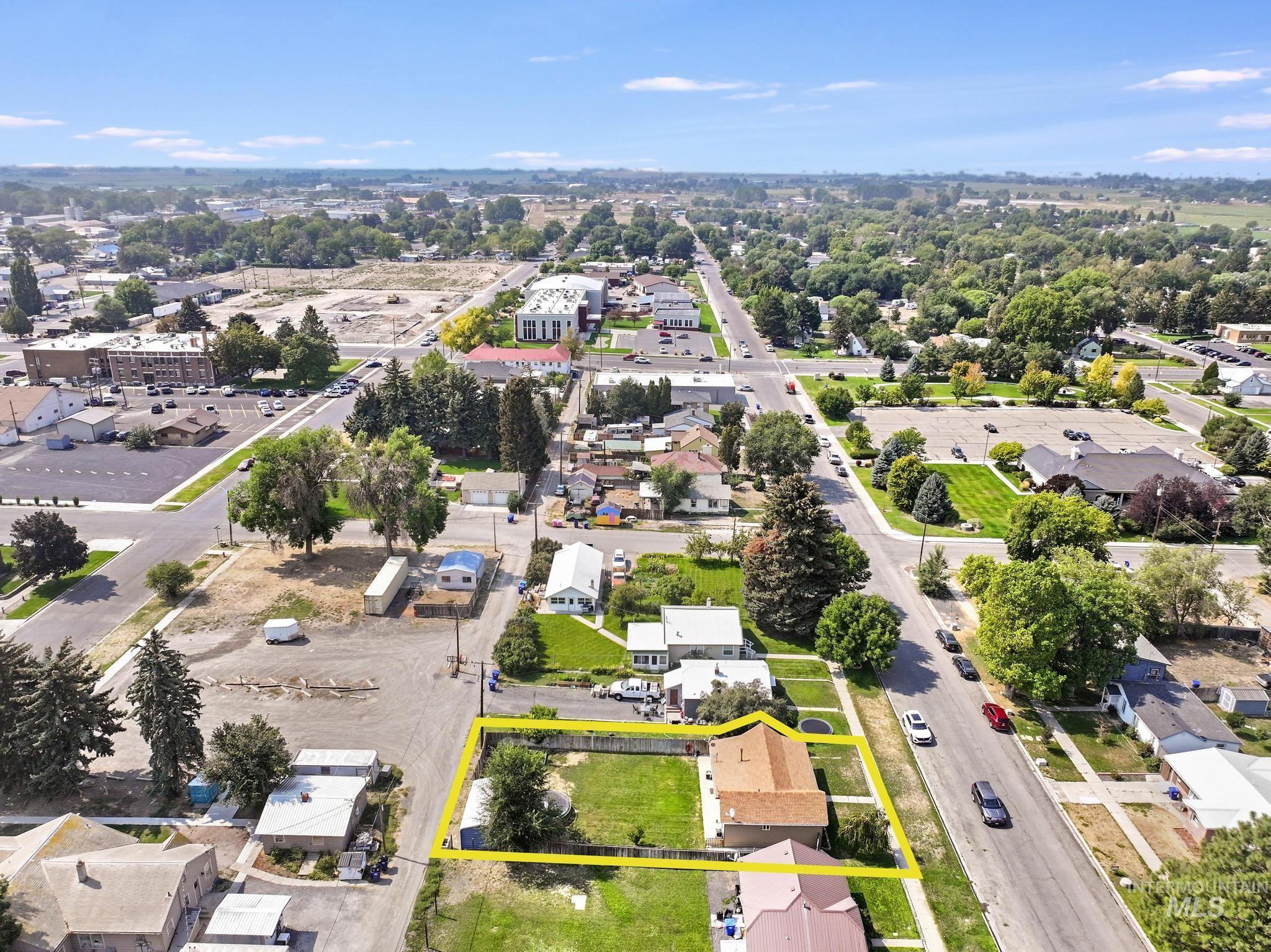 Aerial view of residential area with property parcel outlined