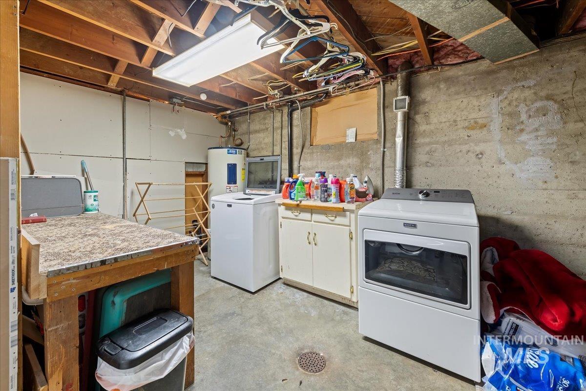 Laundry room featuring cabinet space and washer and dryer