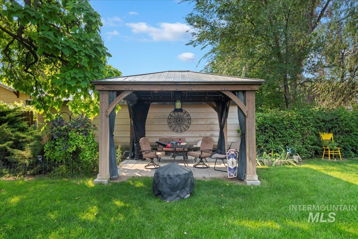View of patio featuring a gazebo