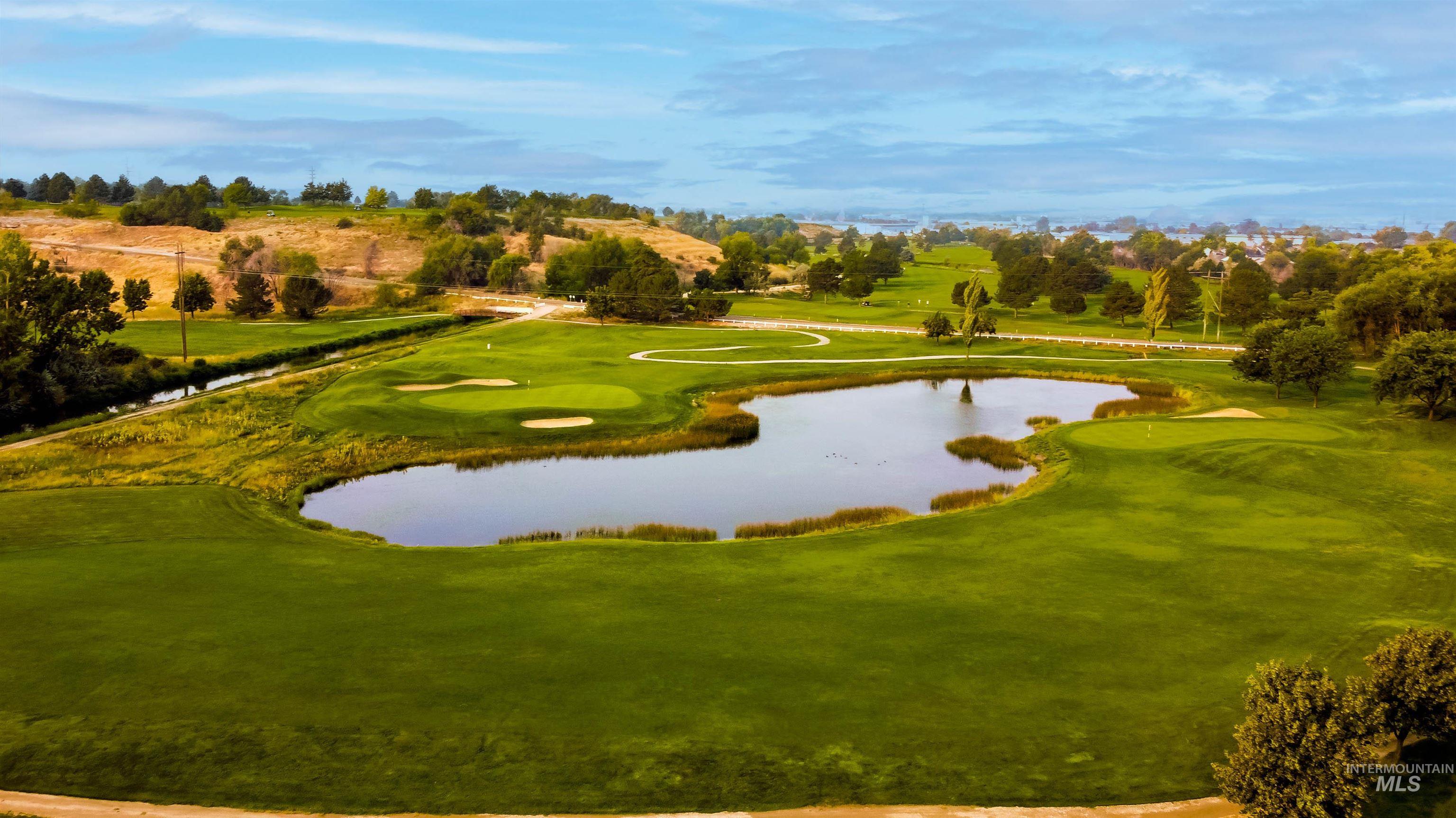 View of home's community with a water view and view of golf course