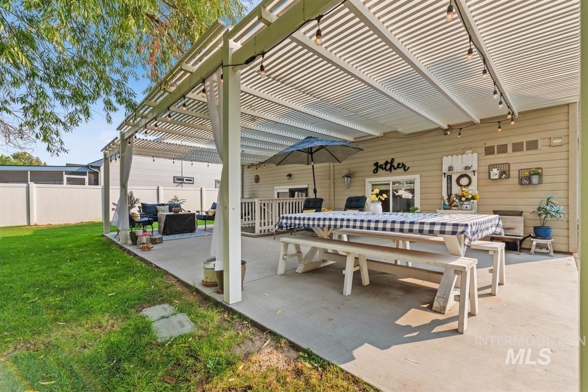 View of patio featuring a pergola and an outdoor living space