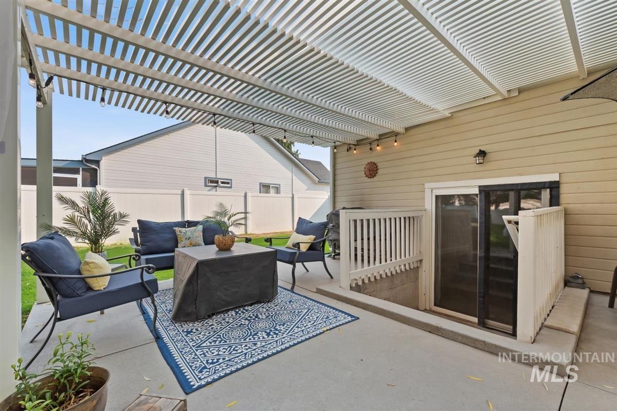 View of patio featuring outdoor lounge area and a pergola