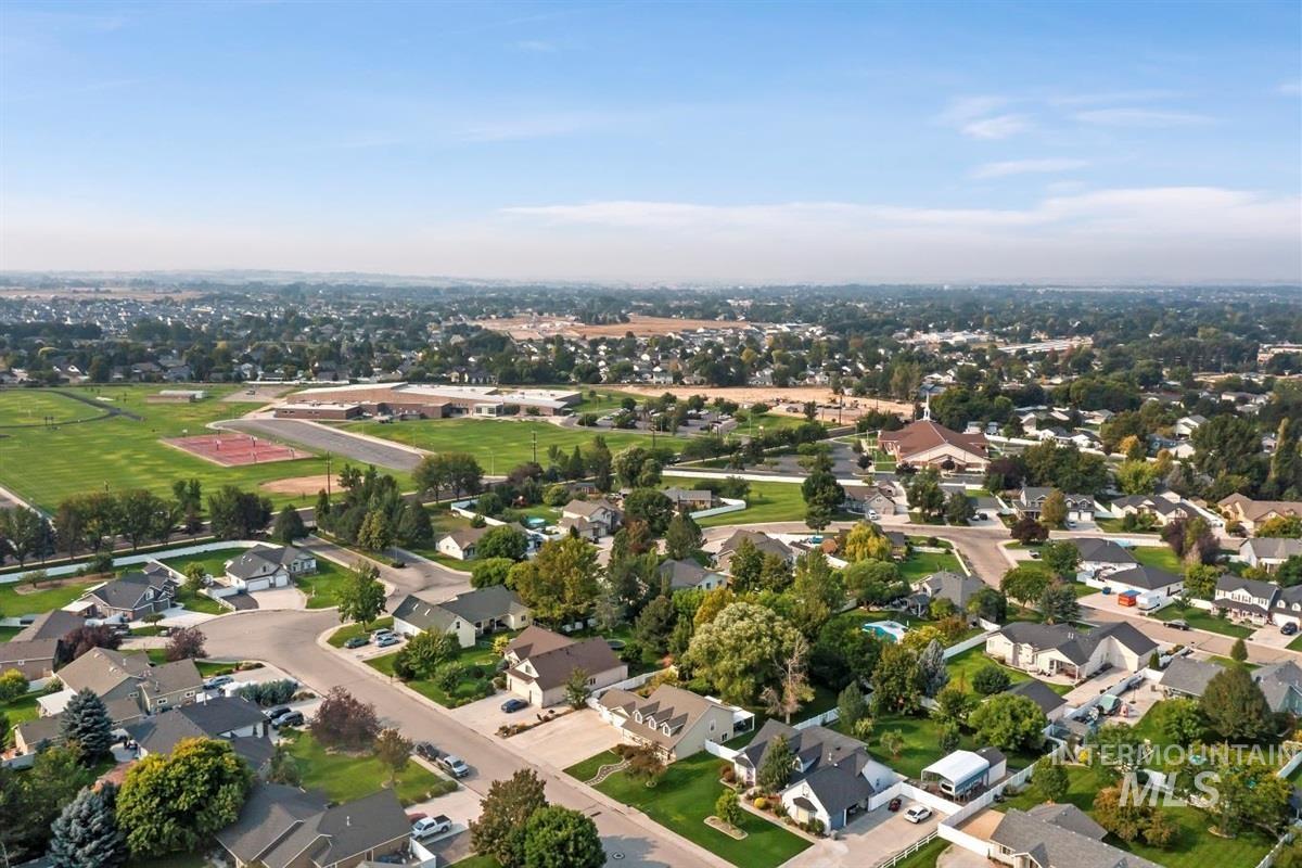 Aerial overview of property's location with nearby suburban area